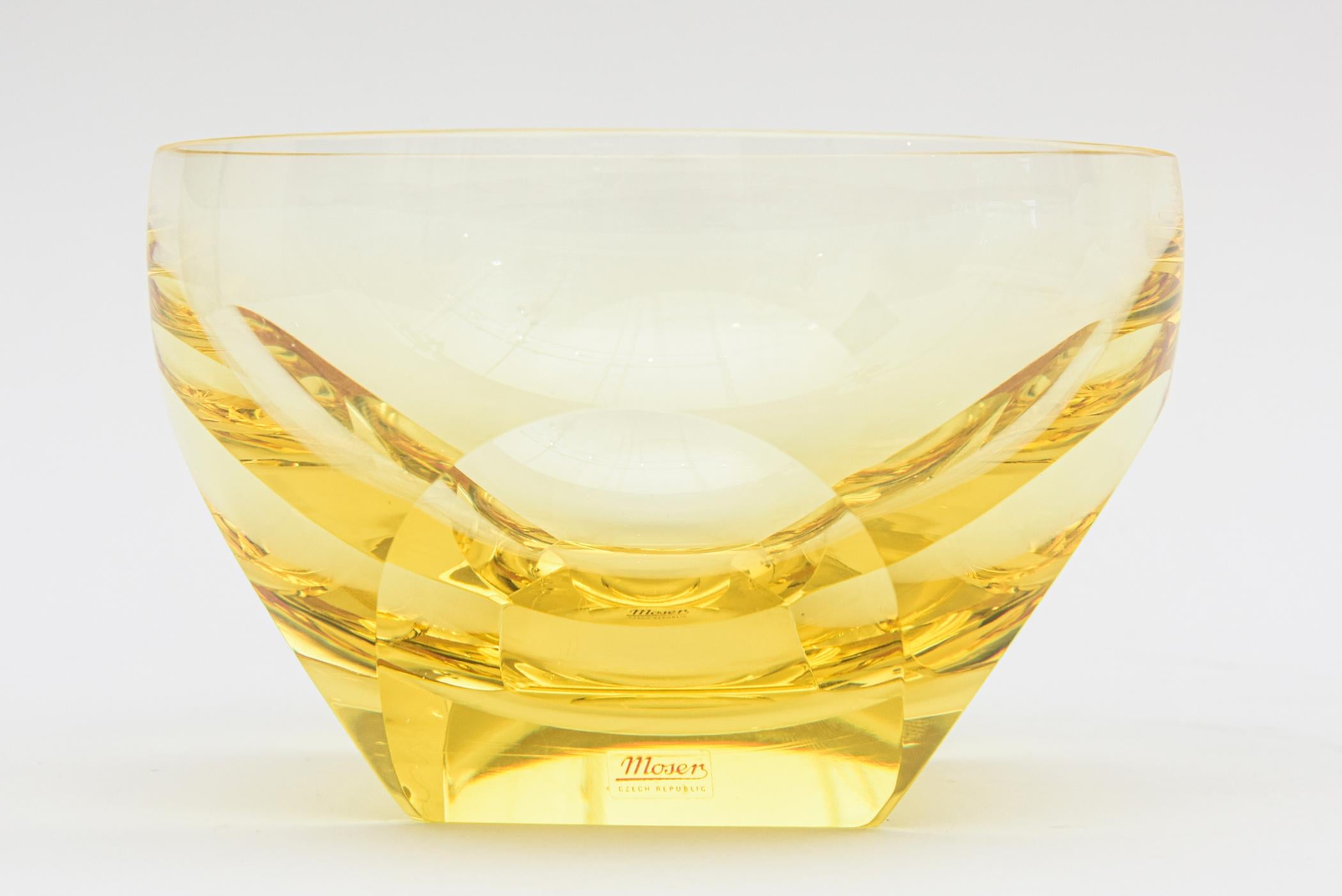 This lovely bowl glass by the Moser glass works in the Czech Republic has faceted sides. It is vintage from the 70's and is a beautiful light color of yellow. This would make great barware for a nut or candy bowl or for any your entertaining needs.