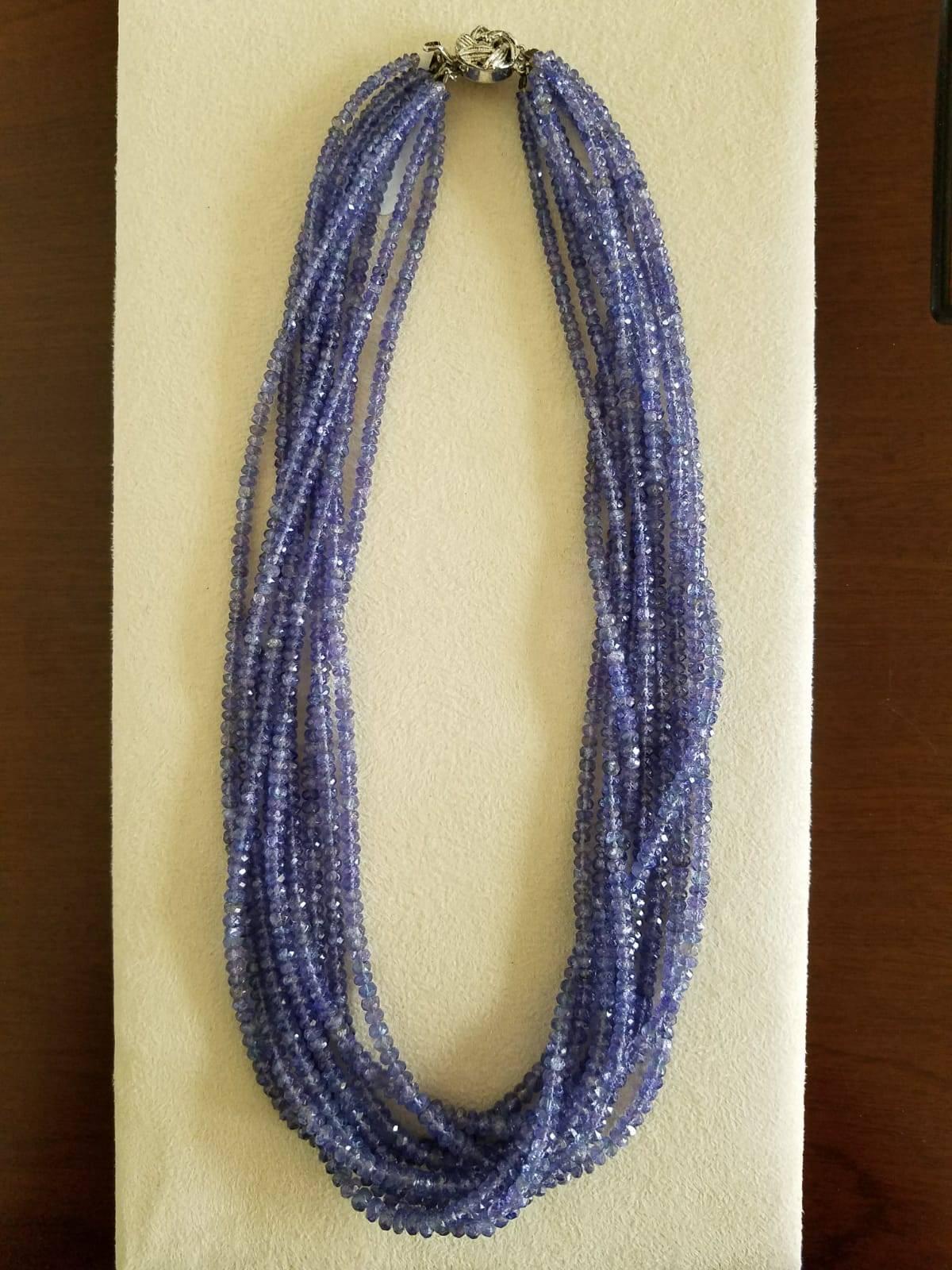A classic Tanzanite beads necklace, comprising of 567 carats of Tanzanite beaded in 9 strands. Clasp is made out of silver. 
Certificate can be provided upon request.
