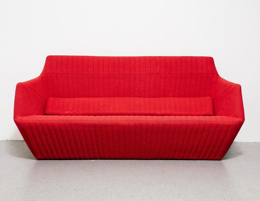 Sofa by French manufacturer Ligne Roset. Ribbed red cloth fabric.