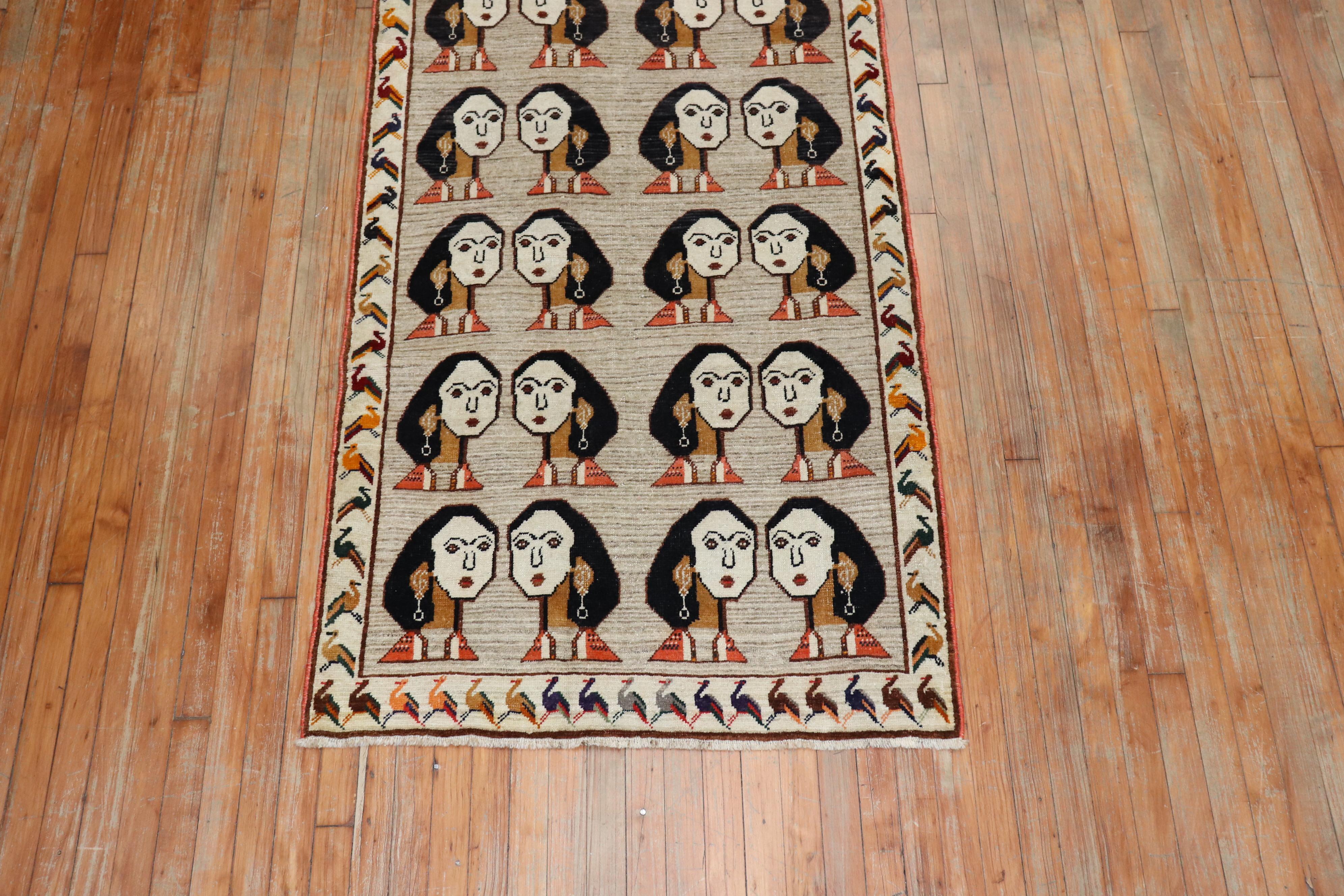 A late 20th century one of a kind Persian Gabbeh rug depicting 20 lady facial figures on a gray ground with an ivory border full of pigeons.

Measures: 3'4'' x 6'.
