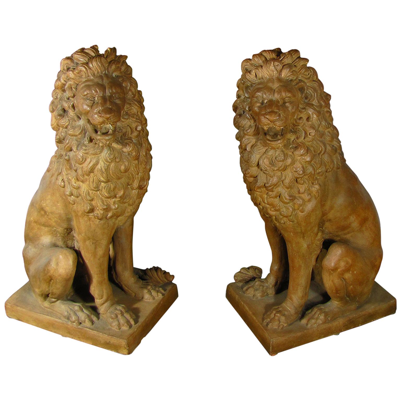 Facing Pair of Early 19th Century Tuscan Terracotta Lion Sculptures For Sale