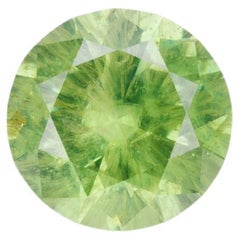 Facted demantoid garnet with obvious horsetail inclusion, 0.53 ct