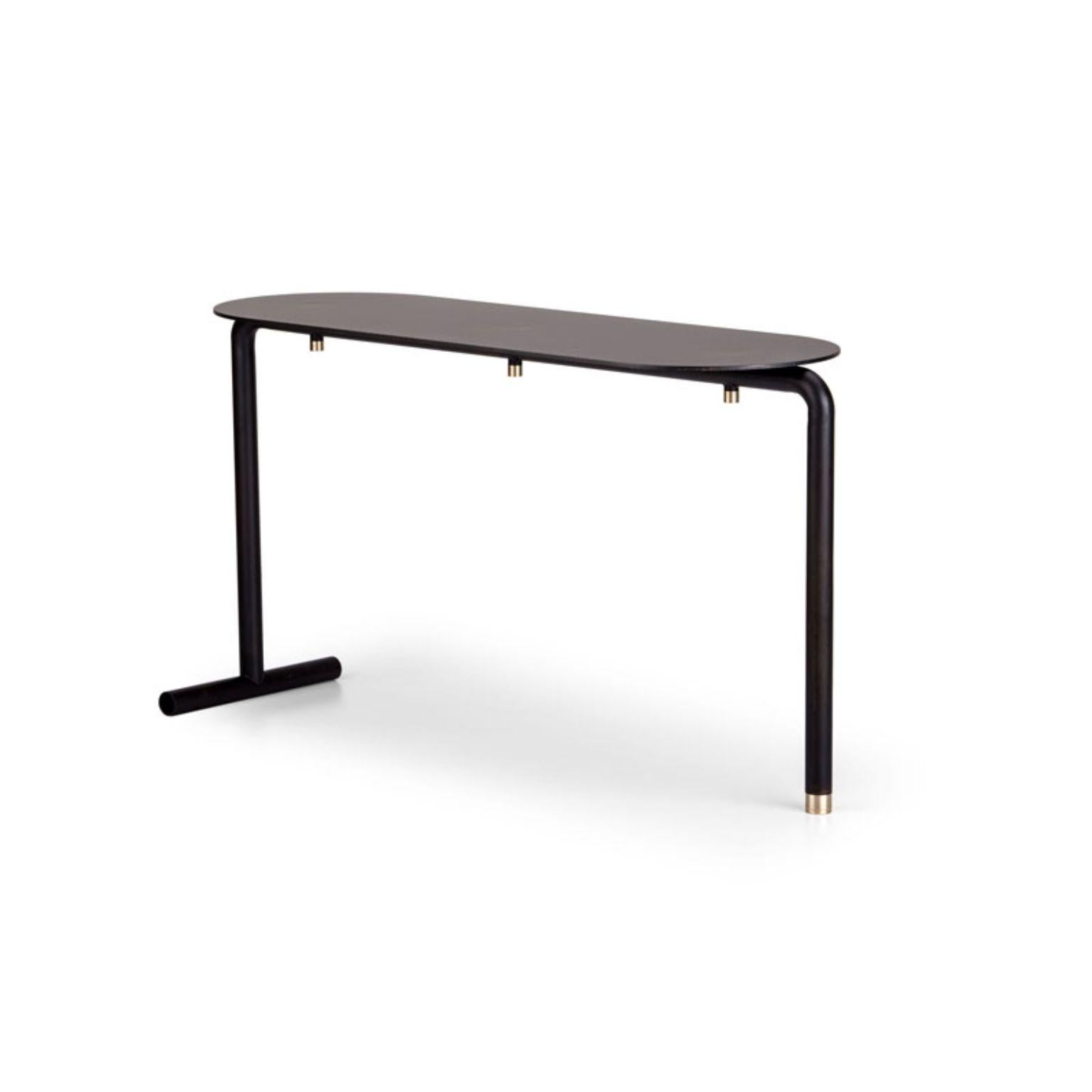 Factory bench by Mingardo
Dimensions: D 86 x W 32 x H 46 cm 
Materials: RAL 9005 black varnished iron structure and satin natural brass details
Weight: 7 kg

Also available in different finishes.

The finesse of the artisan is met with the