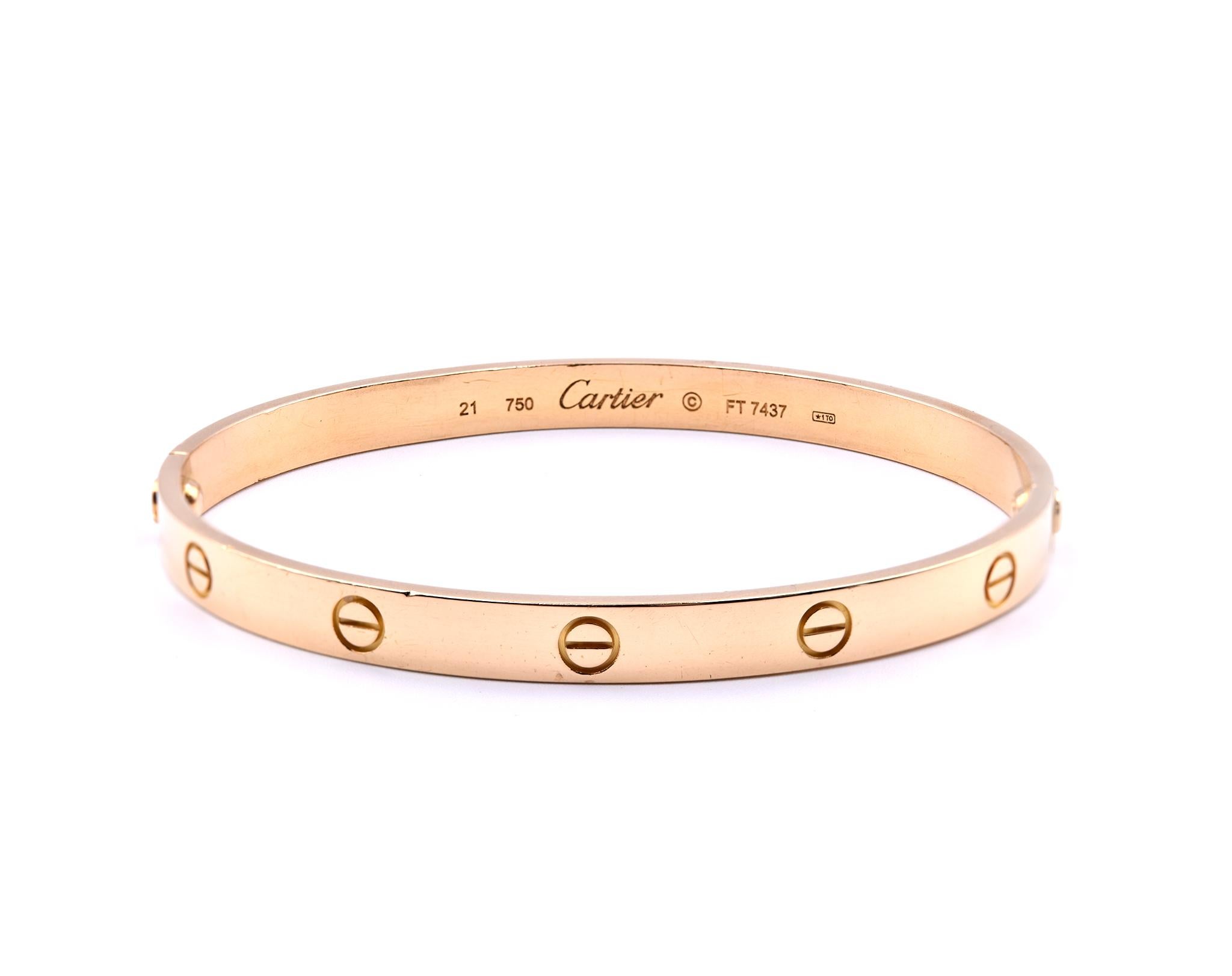 Designer: Cartier
Collection: Love
Material: 18k yellow gold
Dimensions: bracelet fit for 8-inch wrist 
Size: 21
Weight: 40.02 grams
