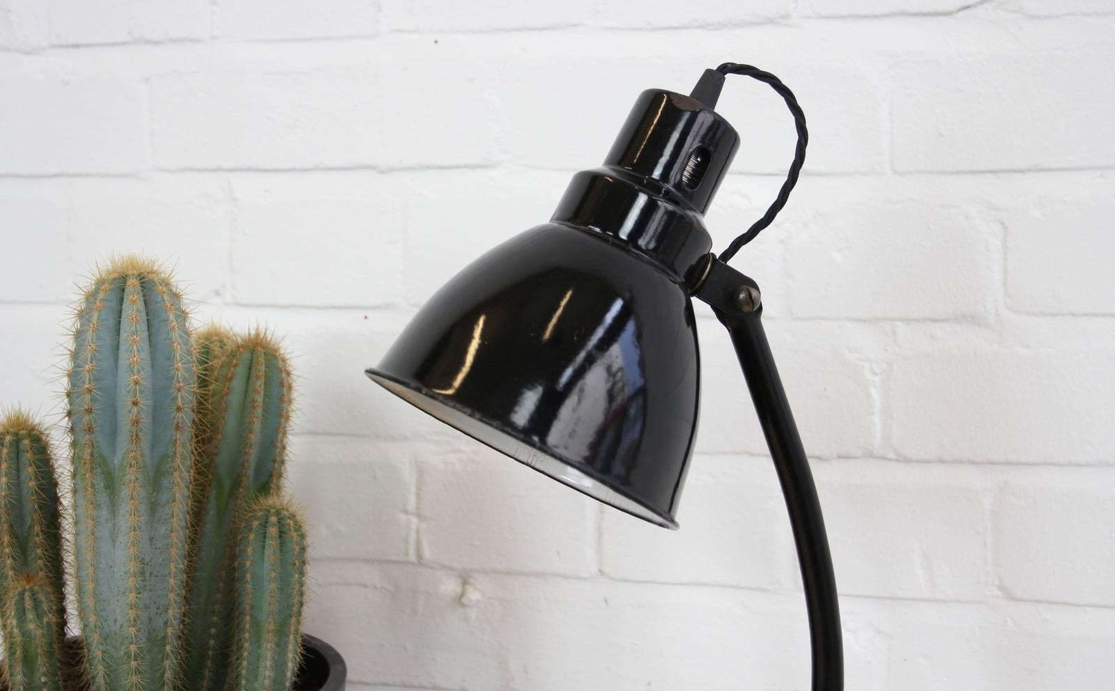 Factory office desk lamp by Gebruder Jacob, circa 1920s

Product code #OA474

- Heavy cast iron base
- Vitreous black enamel stepped shade
- Adjustable shade and arm
- Takes E27 fitting bulbs
- Made by Gebruder Jacob GmBh
- German, circa