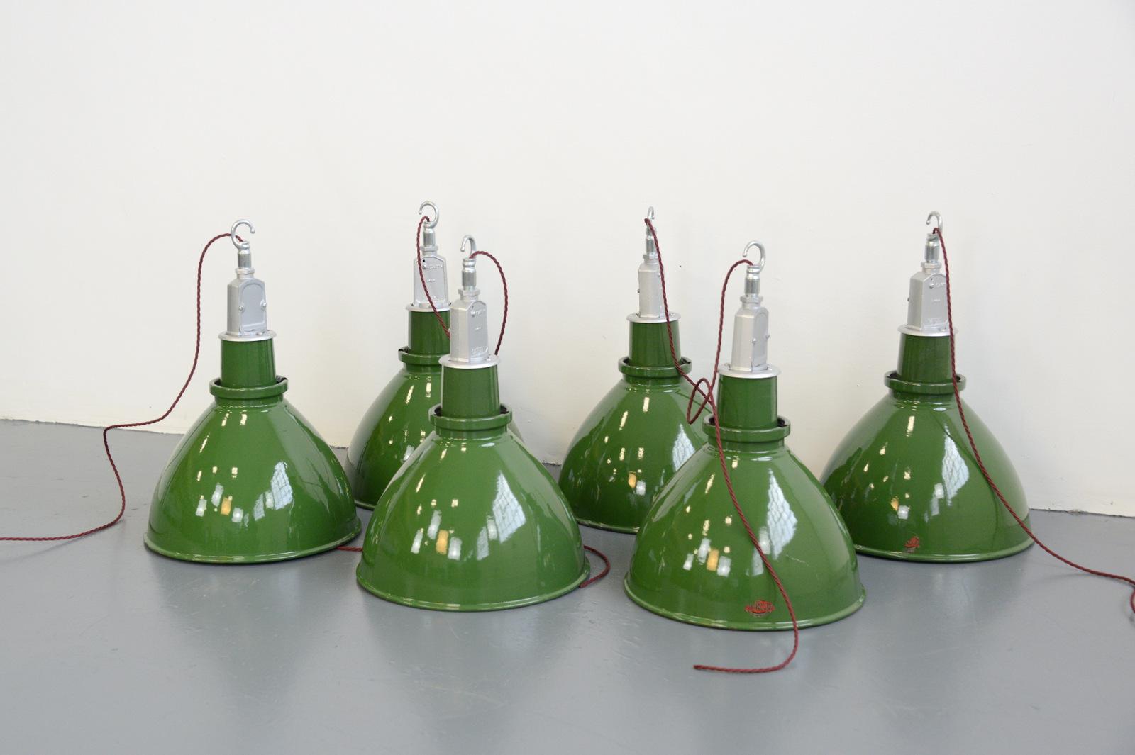- Price is per light
- Vitreous green enamel shades
- White enamel inner reflectors
- Twist off tops
- Takes E27 fitting bulbs
- Comes with 100cm of red twist cable
- Comes with chain and ceiling hook
- Made by Thorlux
- English ~ 1950s
-