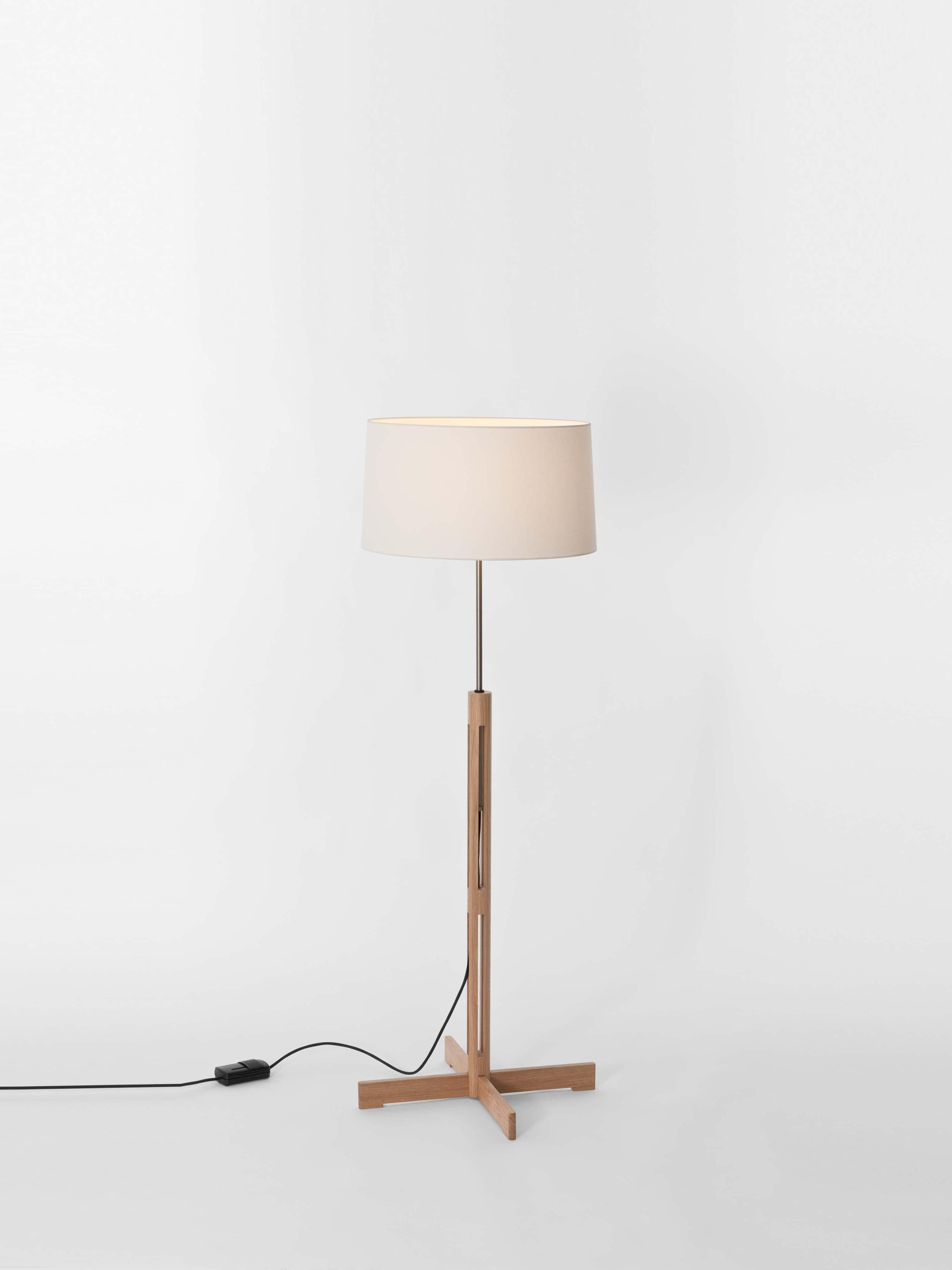 FAD floor lamp by Miguel Milá
Dimensions: D 45 x H 120-150 cm
Materials: Oak wood, linen.
Non height-adjustable version available.

Miguel Milá got everything right compositionally with this demonstration of industrial craftsmanship. Its