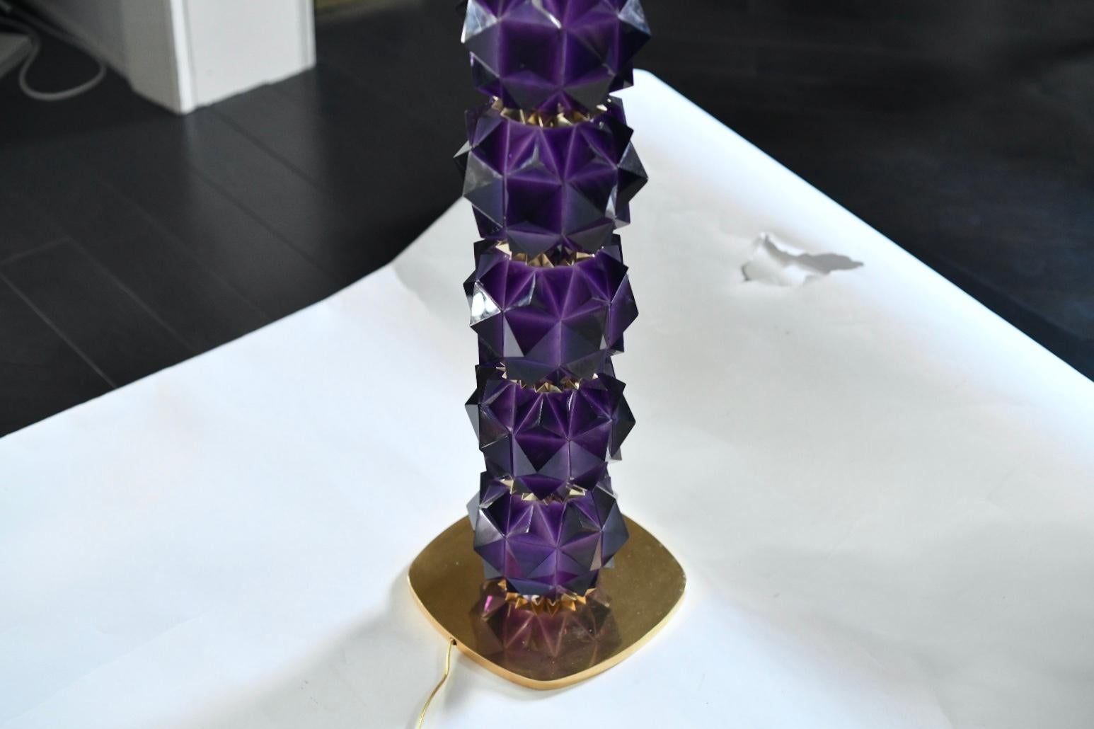 Pair of fine carved faceted amethyst lamps with polished brass decoration. Created by Phoenix Gallery, NYC.
Measures: To the top of rock crystal: 20.5