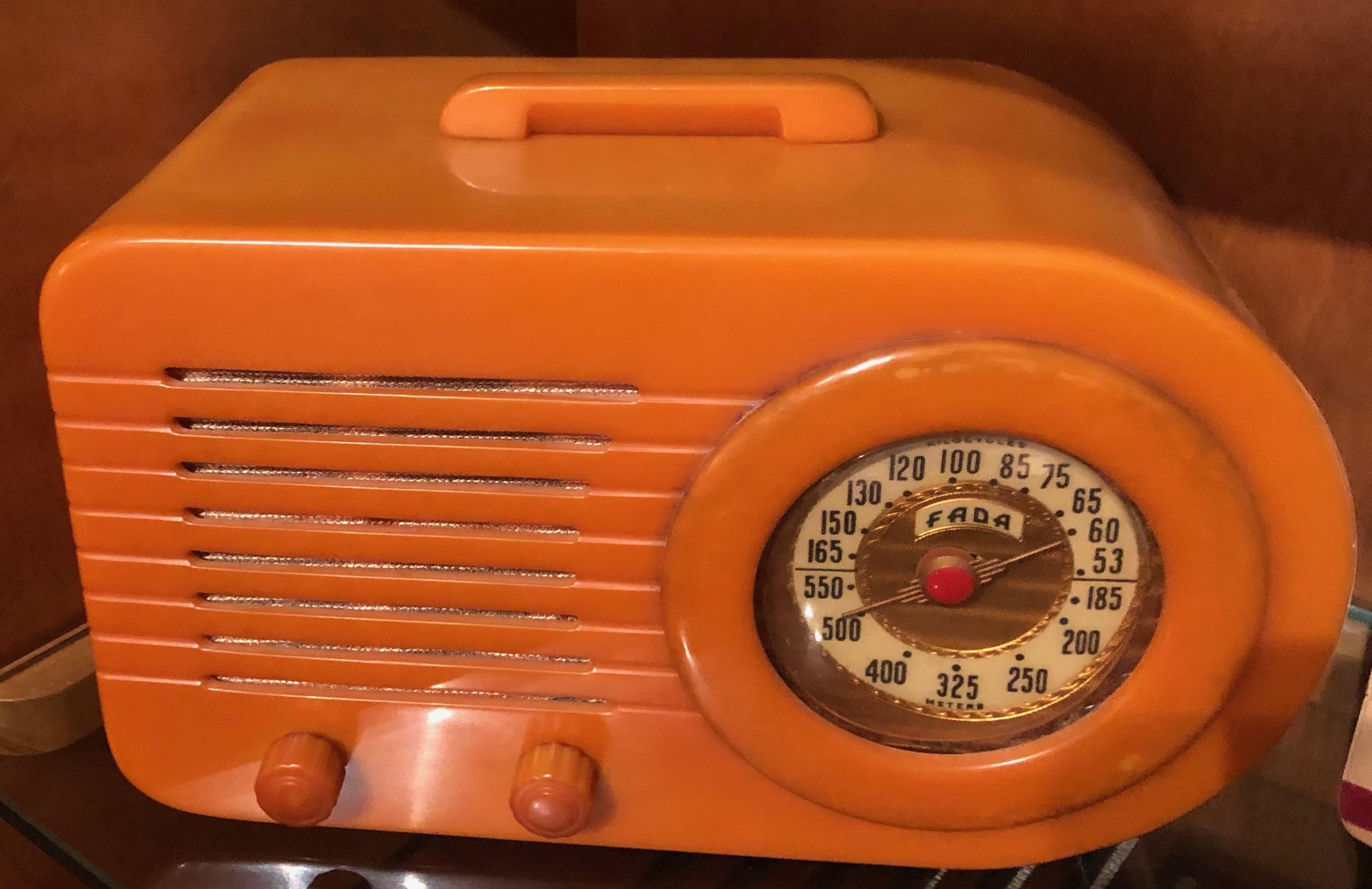 The famous Fada bullet Art Deco Radio in butterscotch Catalin is in excellent original condition. There are no defects in the body, no chips, cracks, or repairs. The chassis has been gone through quite thoroughly and anything requiring service has