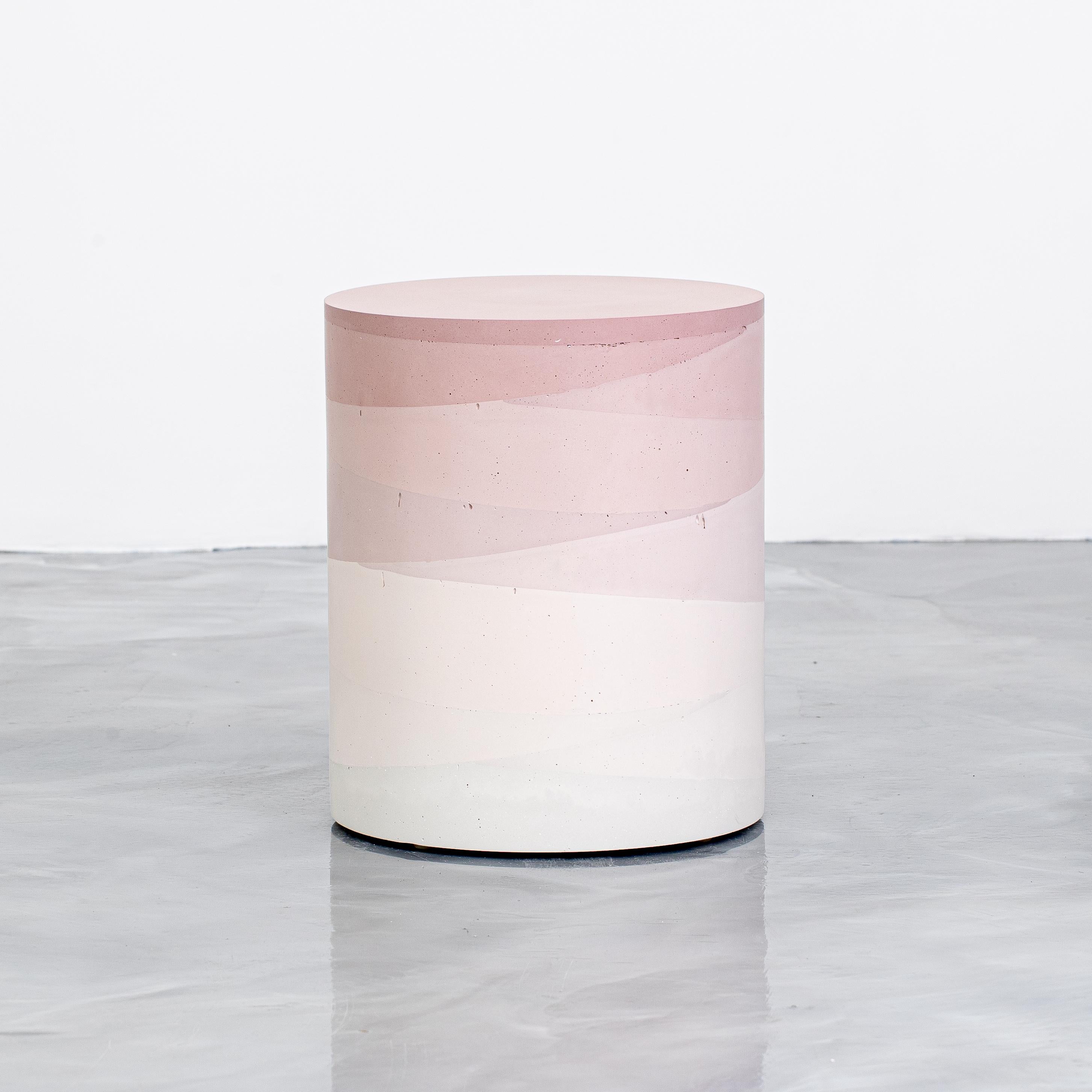 An exploration in the softness and subtly of the materials, the made-to-order drum has a hollow cavity and is cast entirely from hand-dyed cement. Poured in individual hand-dyed layers, starting from the base color blush and fading to white, the