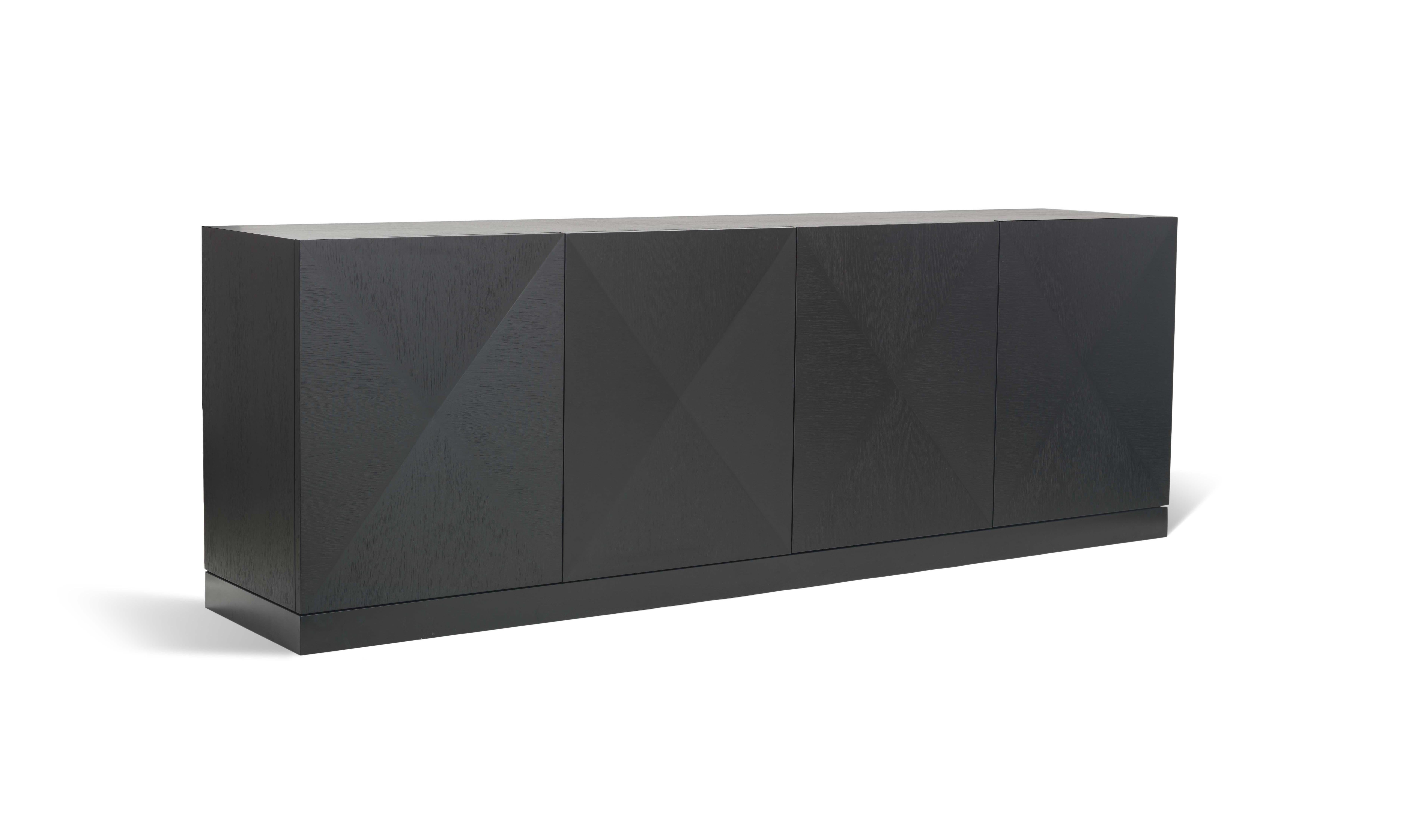 The discrete and geometric form characterizes the versatility of the Fade to Black sideboard. Black is celebrated in its greater simplicity through the mix of black oak with black lacquered iron. Its modern yet timeless design makes this piece a
