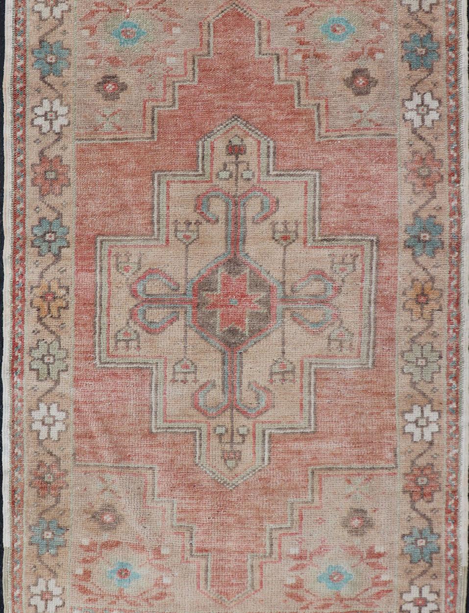 Hand-Knotted Faded Coral and Taupe Vintage Turkish Oushak Rug with Layered Medallion Design For Sale