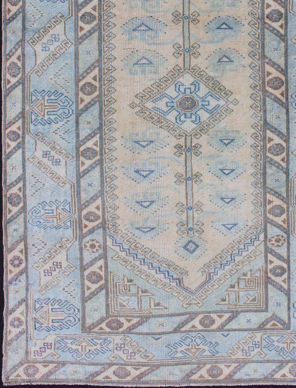 Turkish Faded Oushak Rug from Turkey with All Over Design in Blues and Cream For Sale