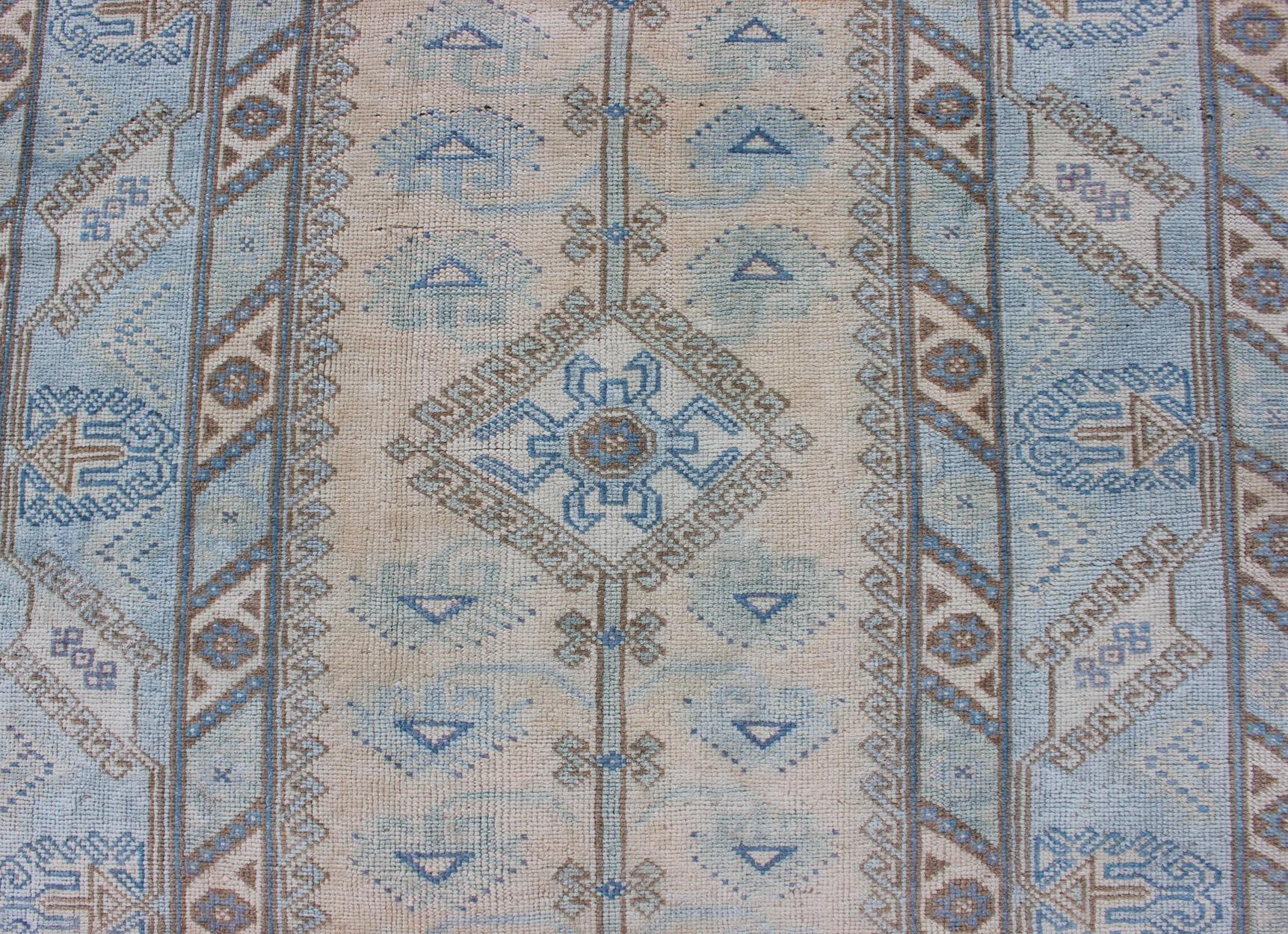 Wool Faded Oushak Rug from Turkey with All Over Design in Blues and Cream For Sale