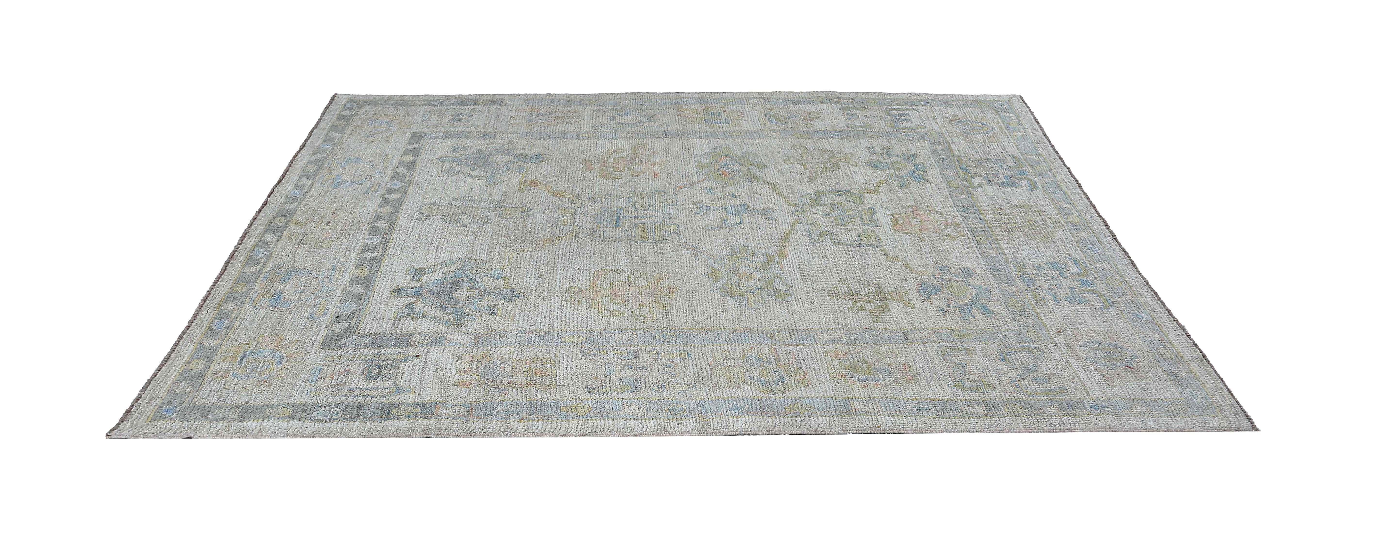 Looking for a unique rug? Check out this 5'0'' x 6'9'' Turkish oushak rug with a faded blue color scheme. The faded effect adds a vintage charm to the rug, while the blue tones give it a calming and relaxing feel. Perfect for adding a touch of