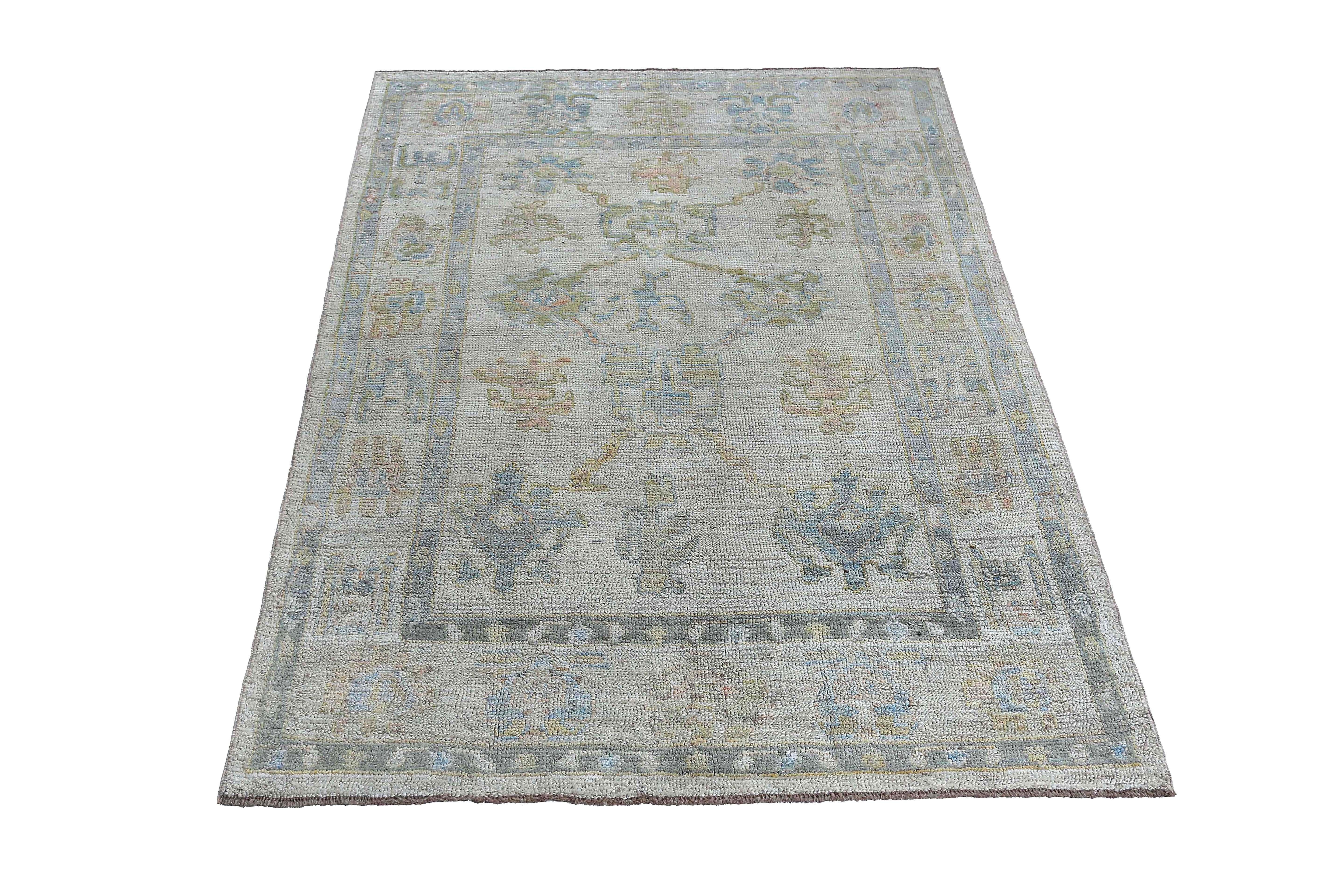 Hand-Woven Faded Oushak Rug with Blue Tones For Sale