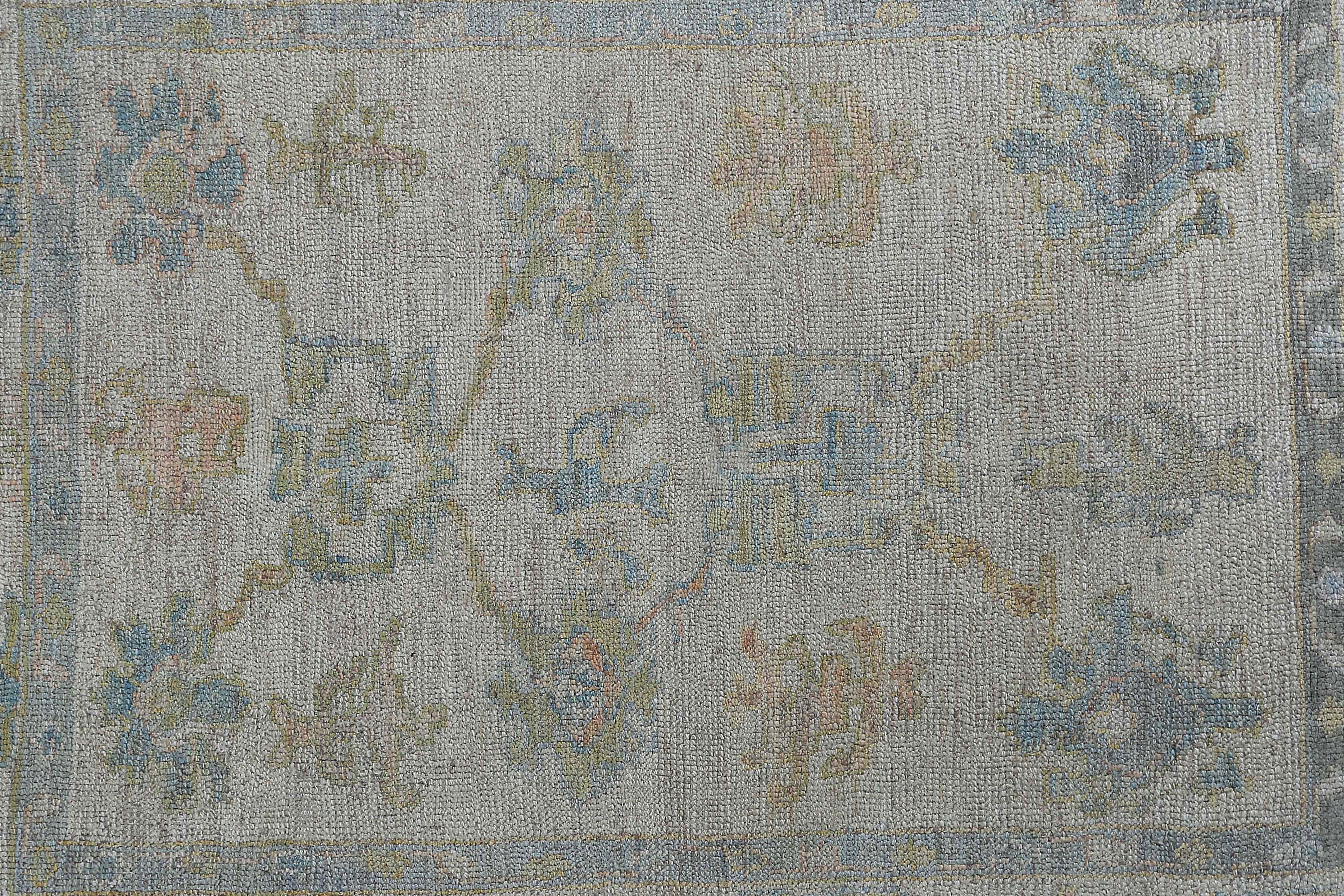 Wool Faded Oushak Rug with Blue Tones For Sale