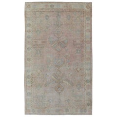 Faded Pink Vintage Turkish Oushak Rug with Tribal Geometric Medallion Design