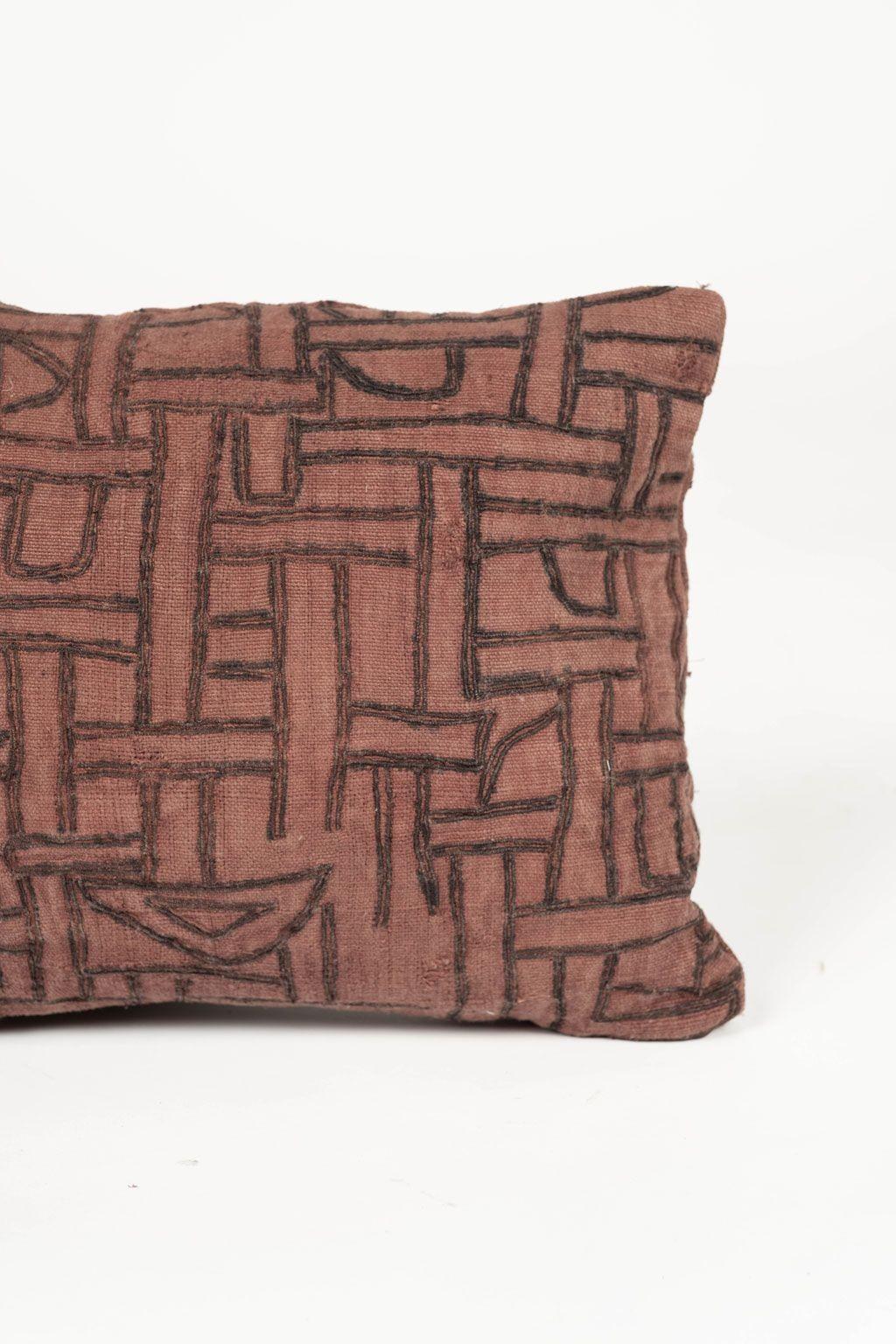Faded plum-color embroidered small lumbar cushion made from an antique handwoven and hand-dyed cotton tribal textile (circa 1930-1954). Hand-sewn into a gorgeous self-backed cushion that includes zip fastener and feather insert. Three more larger