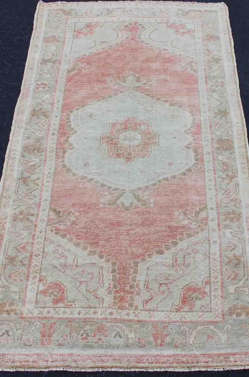 Faded Red and Taupe Vintage Turkish Oushak Rug with Layered Medallion Design For Sale 1
