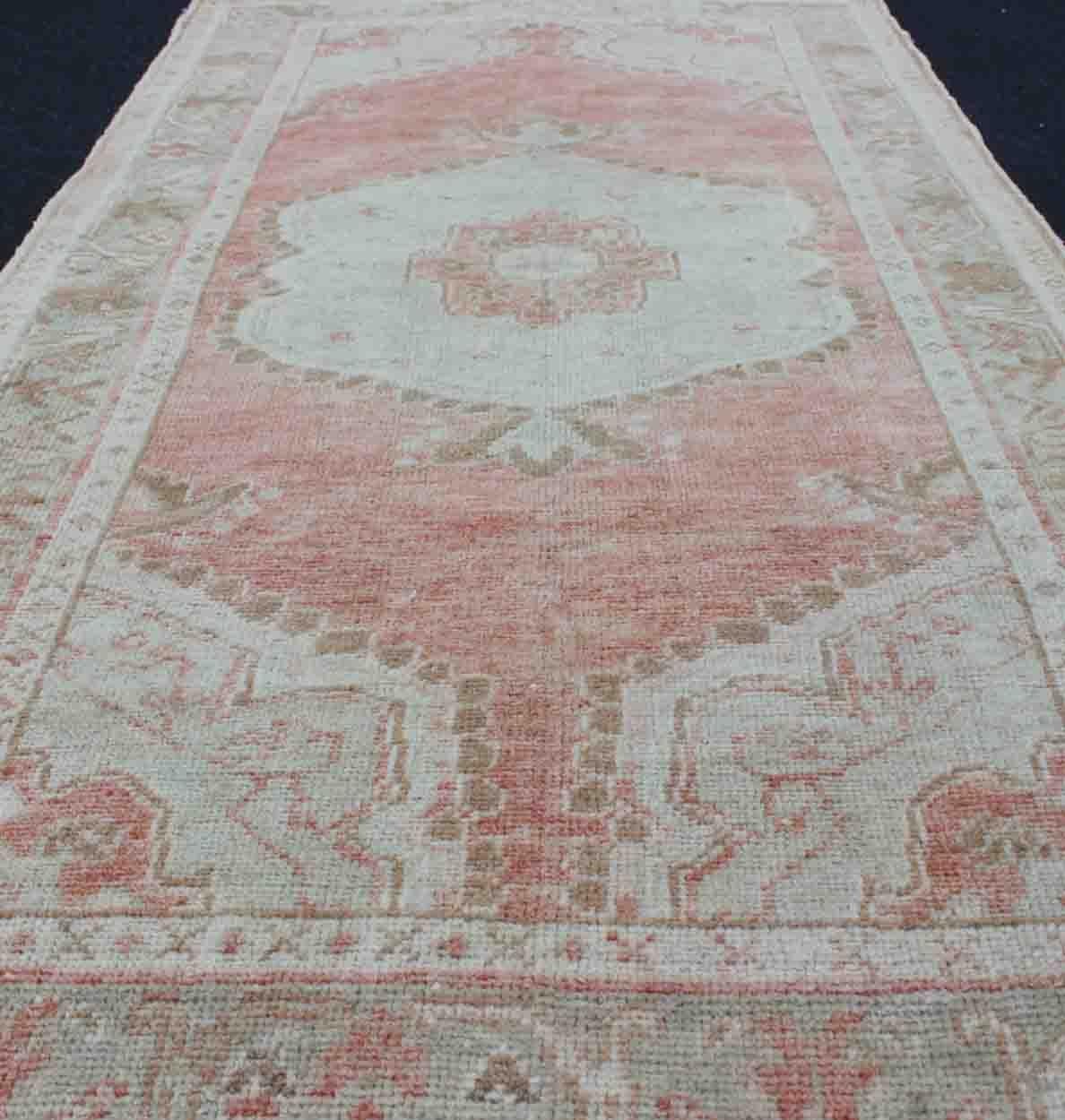 Faded Red and Taupe Vintage Turkish Oushak Rug with Layered Medallion Design For Sale 2