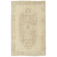 Vintage Faded Turkish Oushak Rug with Central Medallion Design in Cream and Brown