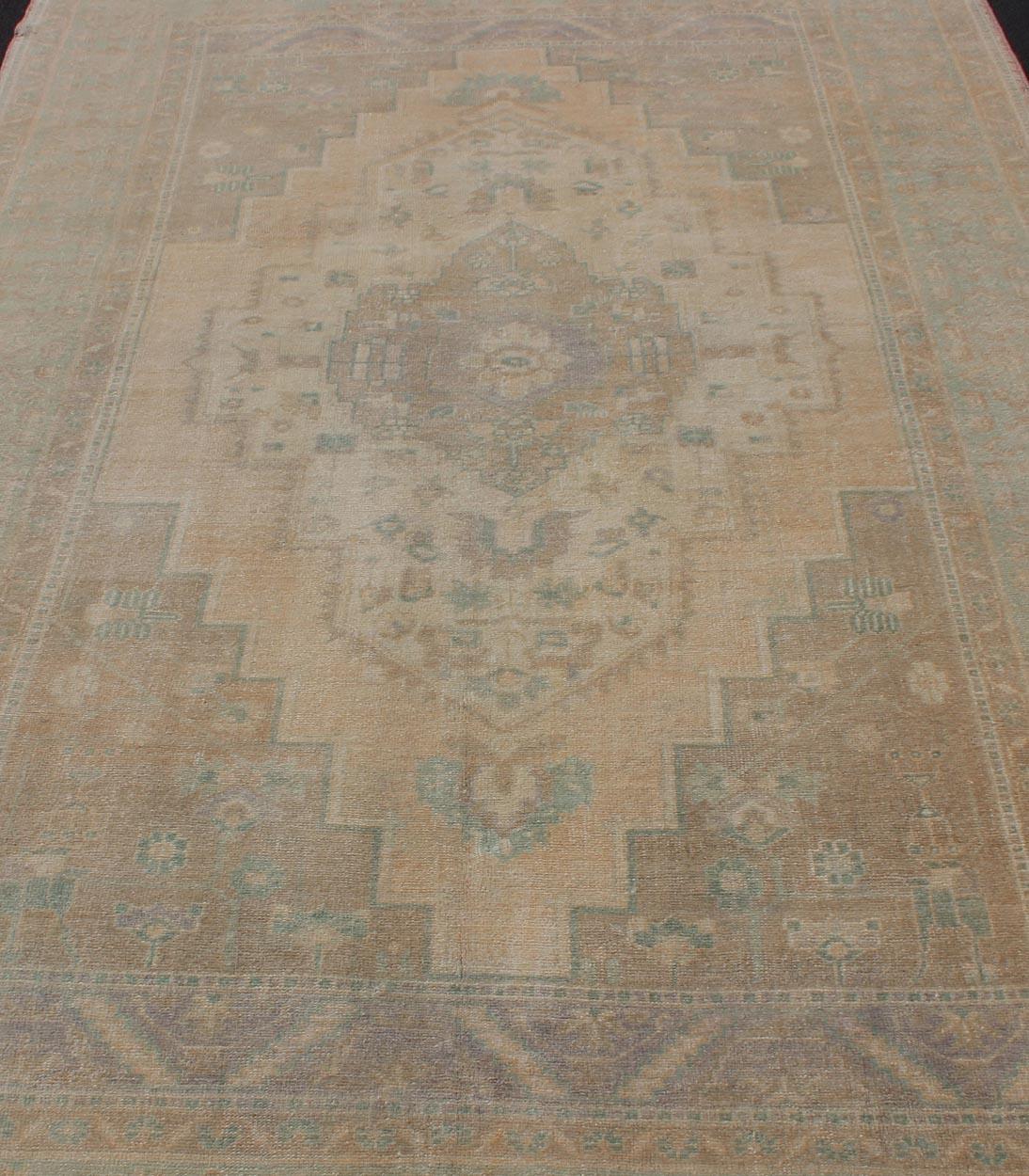 Faded Turkish Oushak with Medallion with Muted Colors of Tan, Muted Light Peach For Sale 1