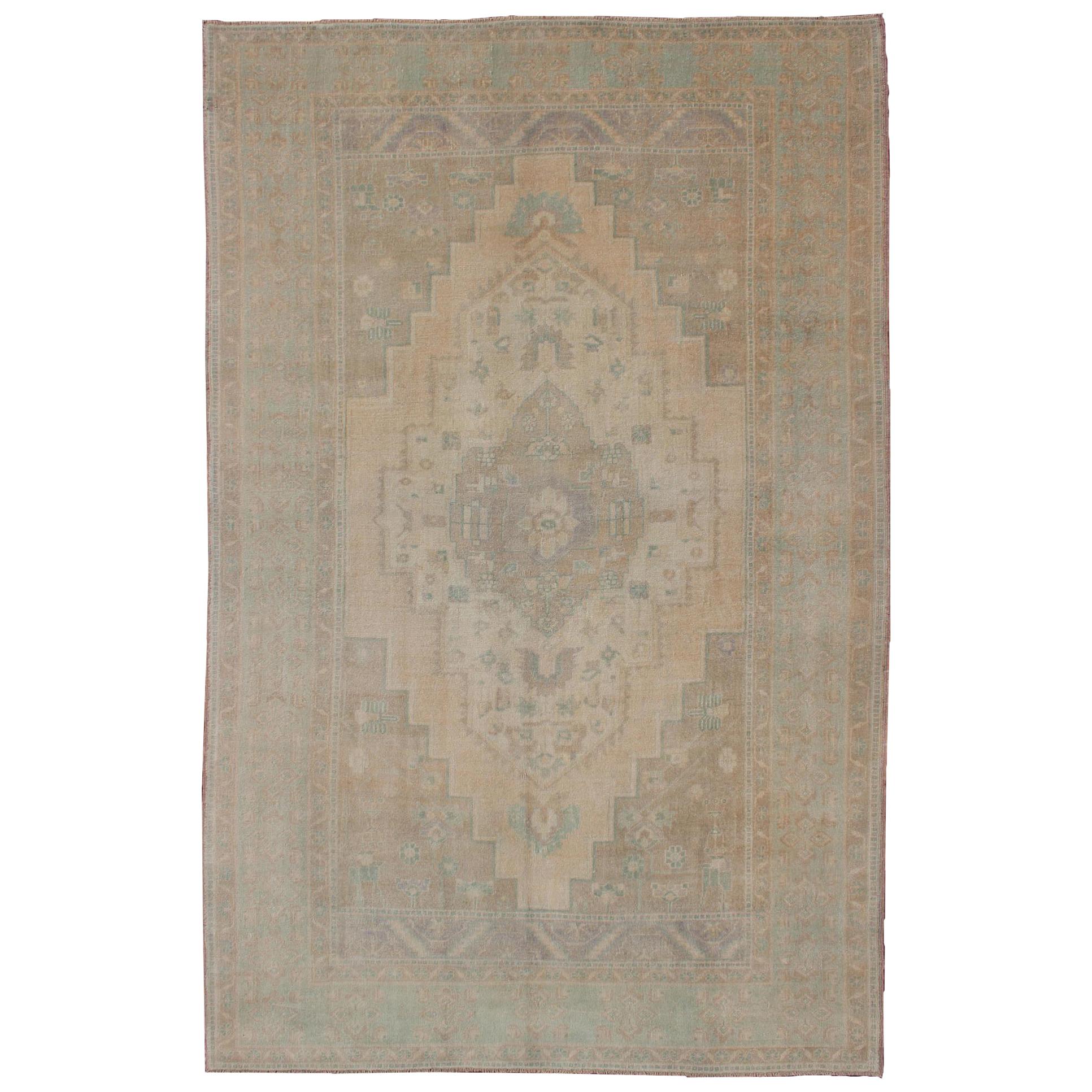 Faded Turkish Oushak with Medallion with Muted Colors of Tan, Muted Light Peach For Sale