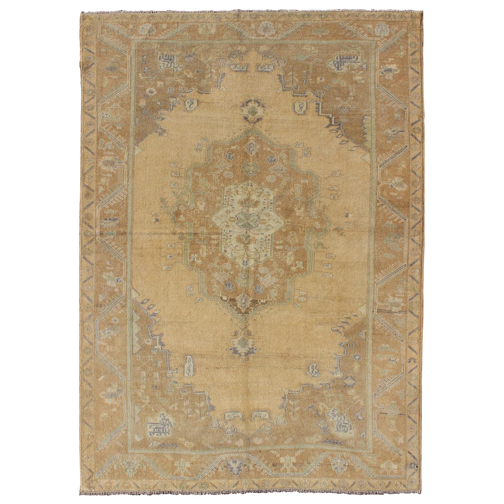 Faded Vintage Turkish Oushak Rug with Layered Medallion