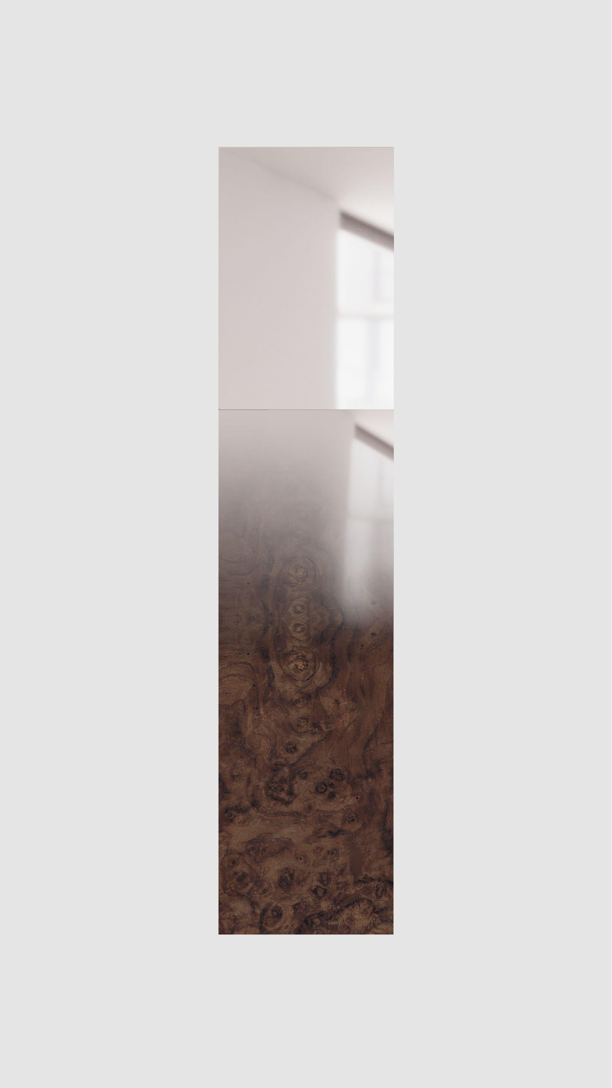Fading wood mirror by Formaminima.
Limited edition.
Dimensions: 14 x 35 x H 157.5 cm.
Materials: Walnut briarwood blend with grey hand-ground crystal layering, fading mirror finish applied by hand.
Flush wall metal bracket.

The Mirror/Zero