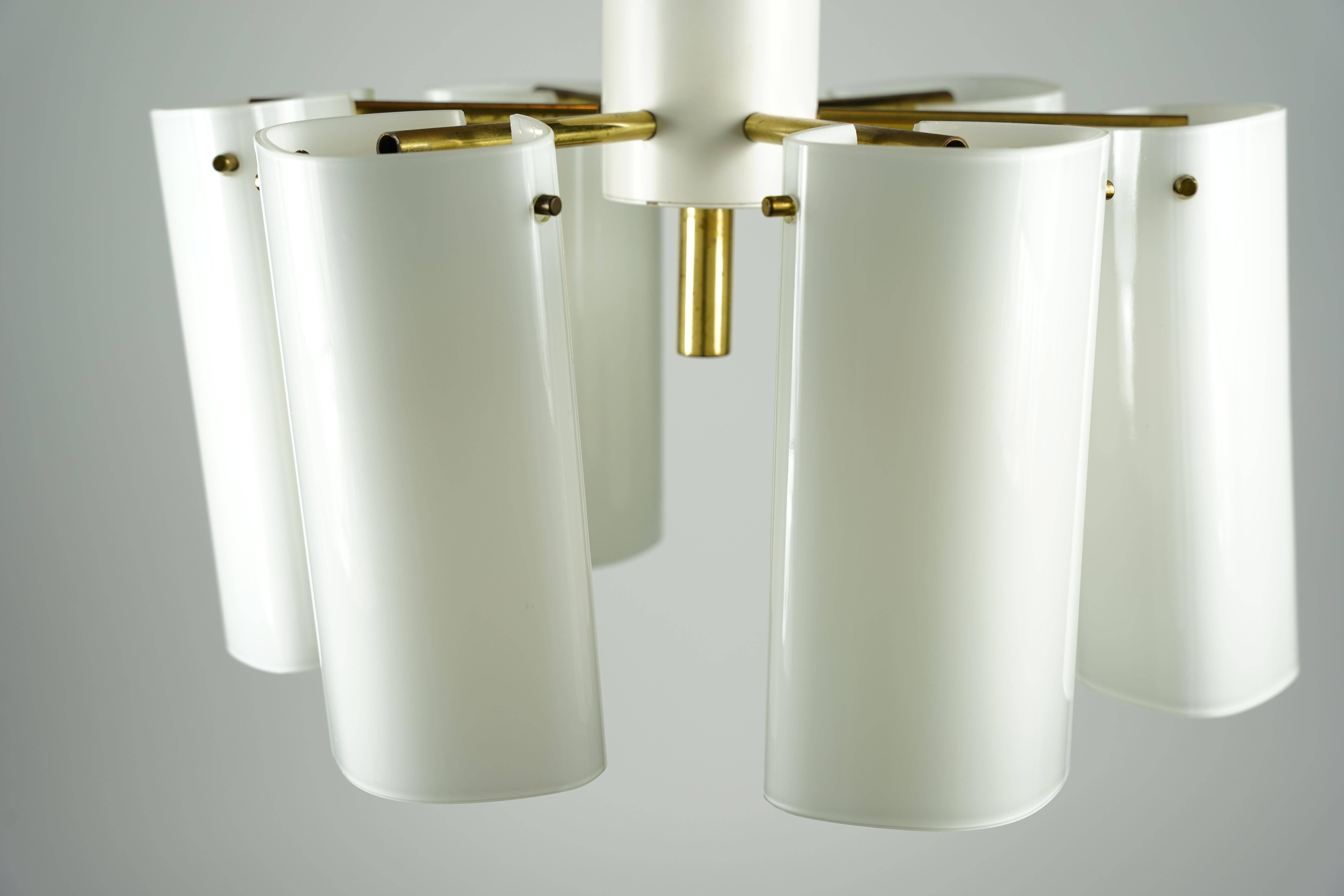 Fagerhult semi flush mount opaline glass and brass, Sweden, 1960
Beautiful simple clean Swedish 1960s semi flush mounts by Fagerhult, six lid up opaline shades hung on brass spokes attached to a white painted center metal frame.
Designed by Gert