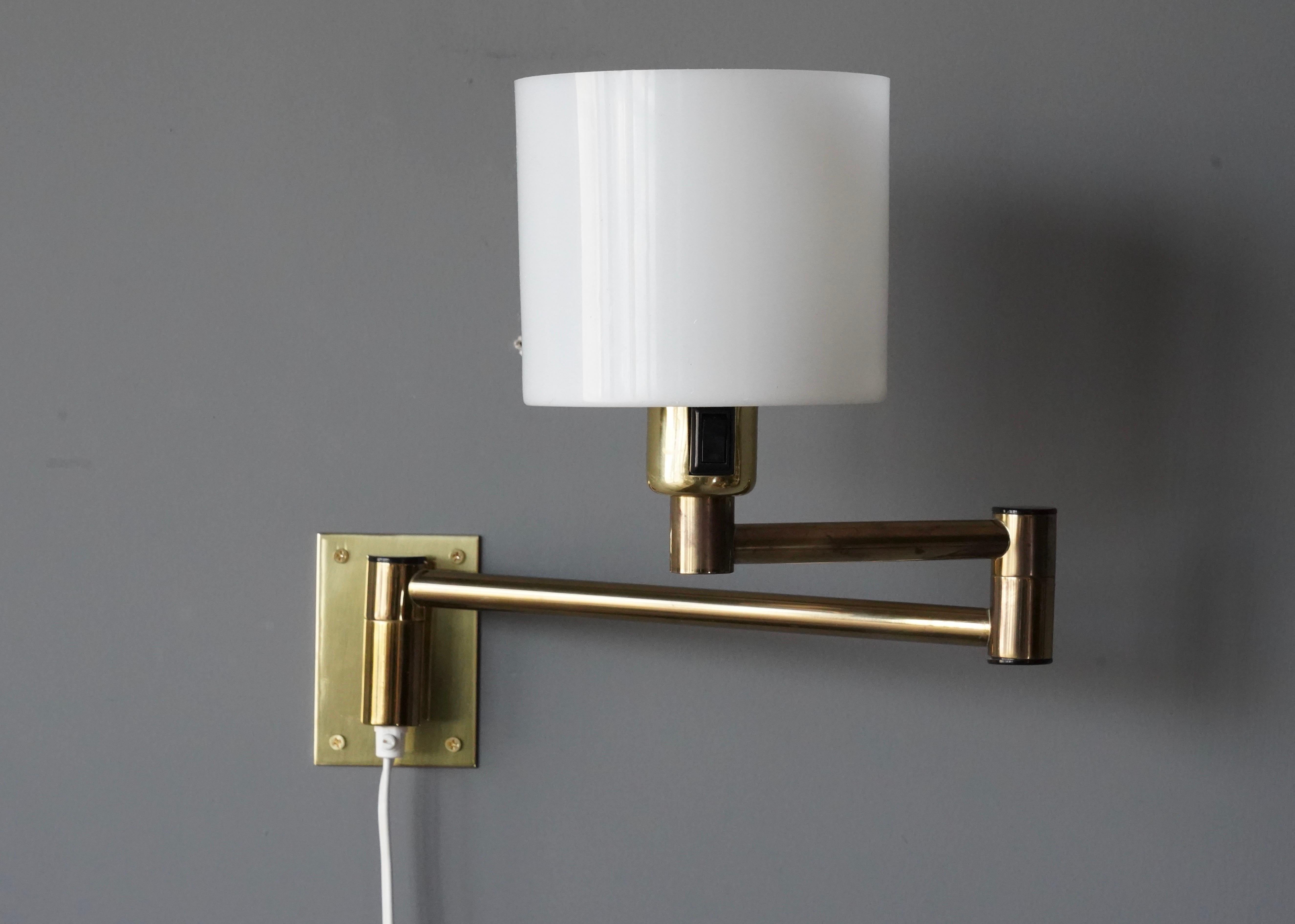 A pair of wall lights. Designed and produced by Fagerhults, Sweden, c. 1970s. Features brass and original acrylic diffusers.

Dimensions variable.