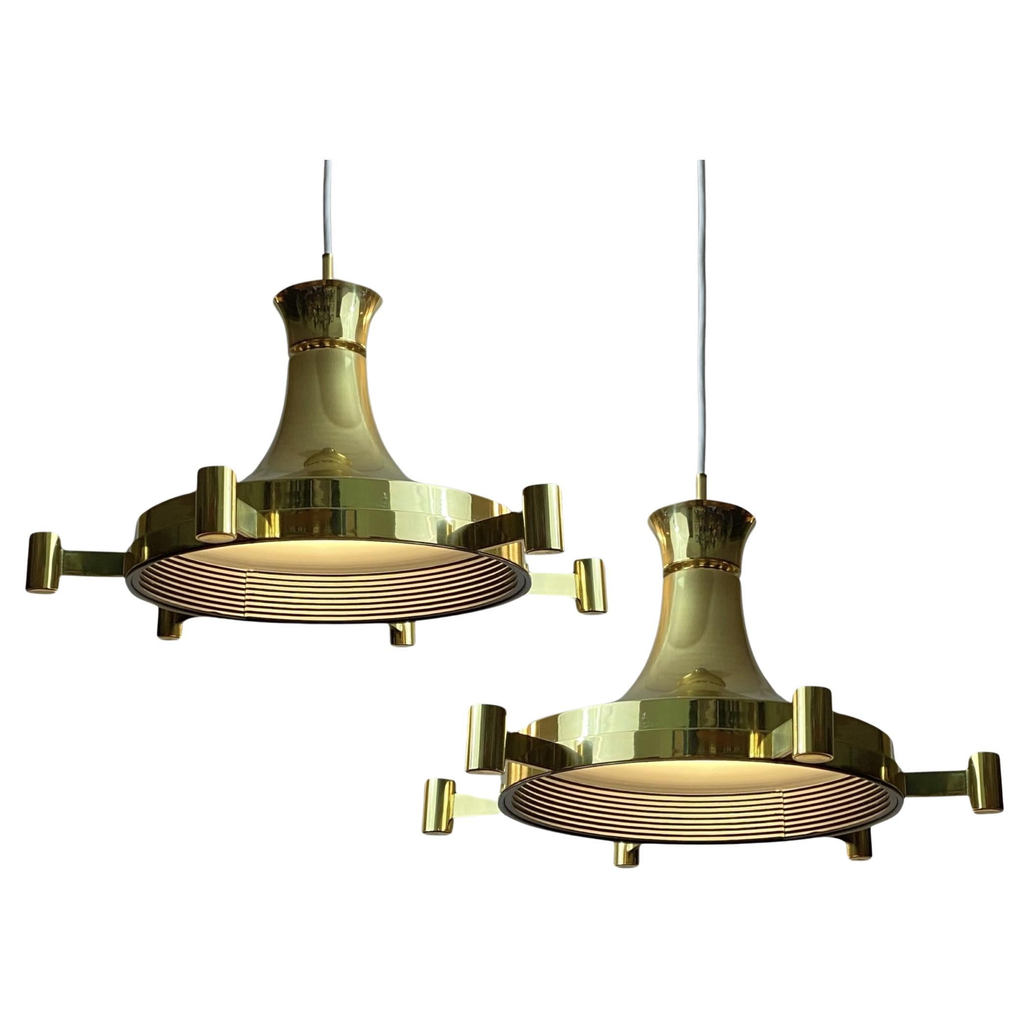 Fagerhults Belysning, a pair of mid-century brass pendant lamps, Sweden, 1960s