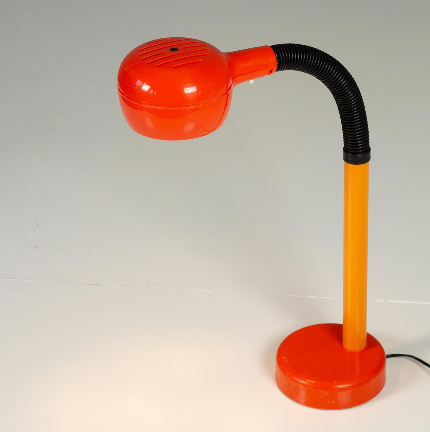 Fagerhults Cobra desk lamp 1975.

Rounded and balanced, with a funky vintage orange. The goose neck can be placed in any desired position. This design won the prestigious IF design award in 1975. The foot of the lamp has some wear, which is quite
