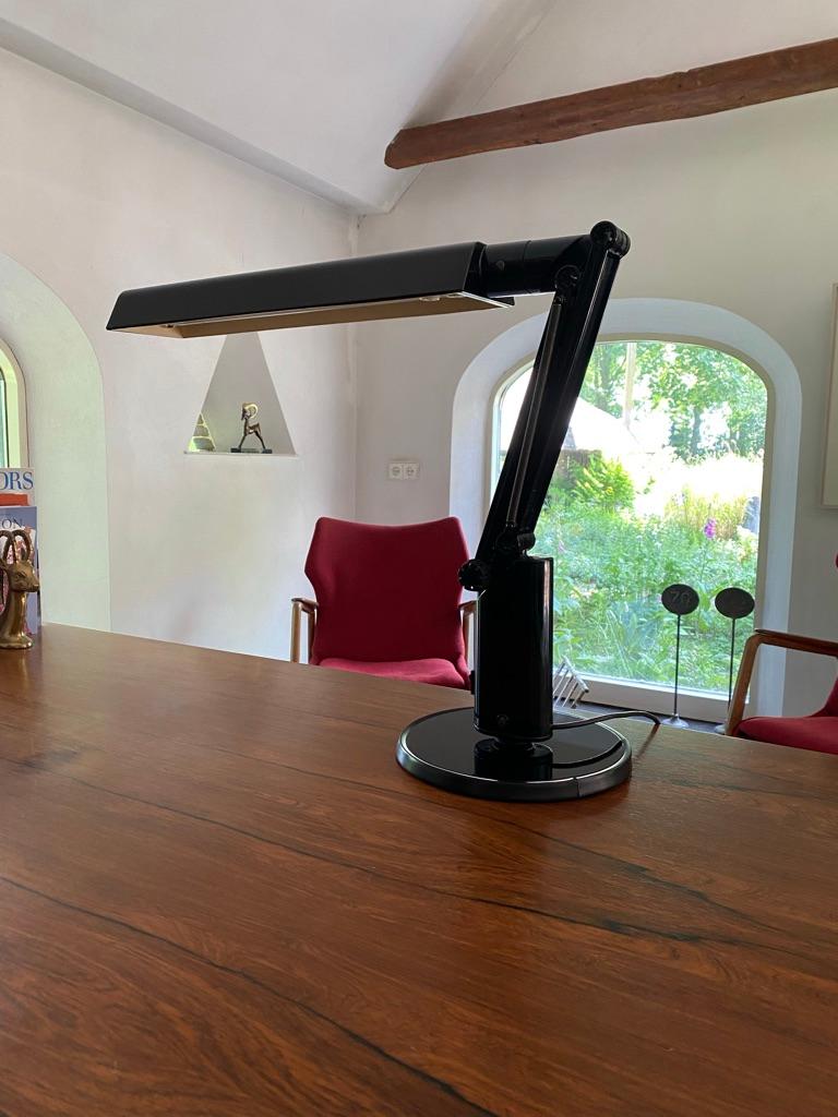 Fagerhults Lucifer the iconic 70's desklamp by the designers Tom Ahlström & Hans Ehrich (Also known as A&E design) for Fagerhults Sweden. This version of the lucifer lamp has a larger base with rubber edge
The lamp was designed 1975. The lamp has