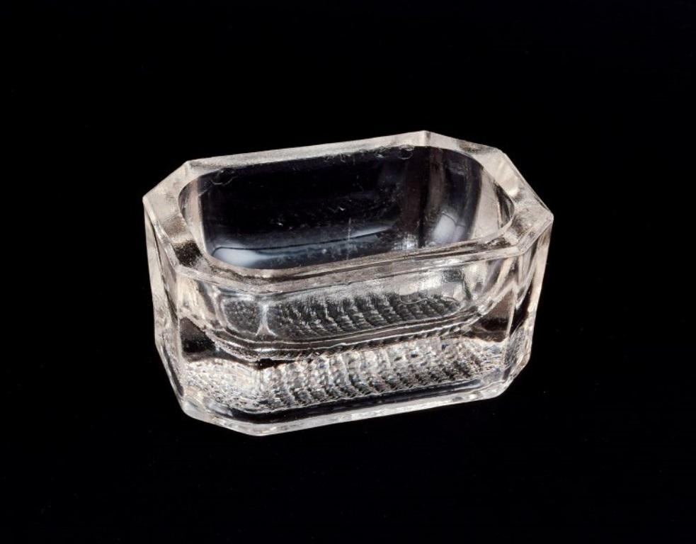 Fåglavik Glasbruk (1874-1980), Sweden.
Six salt cellars in handcrafted clear glass. 
Private Swedish collection. 
Mid-20th century. 
In excellent condition. 
Largest: L 7.5 cm x B 5.0 cm x H 3.5 cm.
