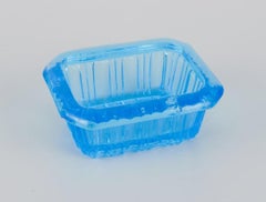 Fåglavik Glasbruk. Four salt cellars in blue glass. Sweden, mid-20th C.