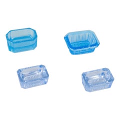 Fåglavik Glasbruk. Four salt cellars in blue glass. Sweden, mid-20th C.