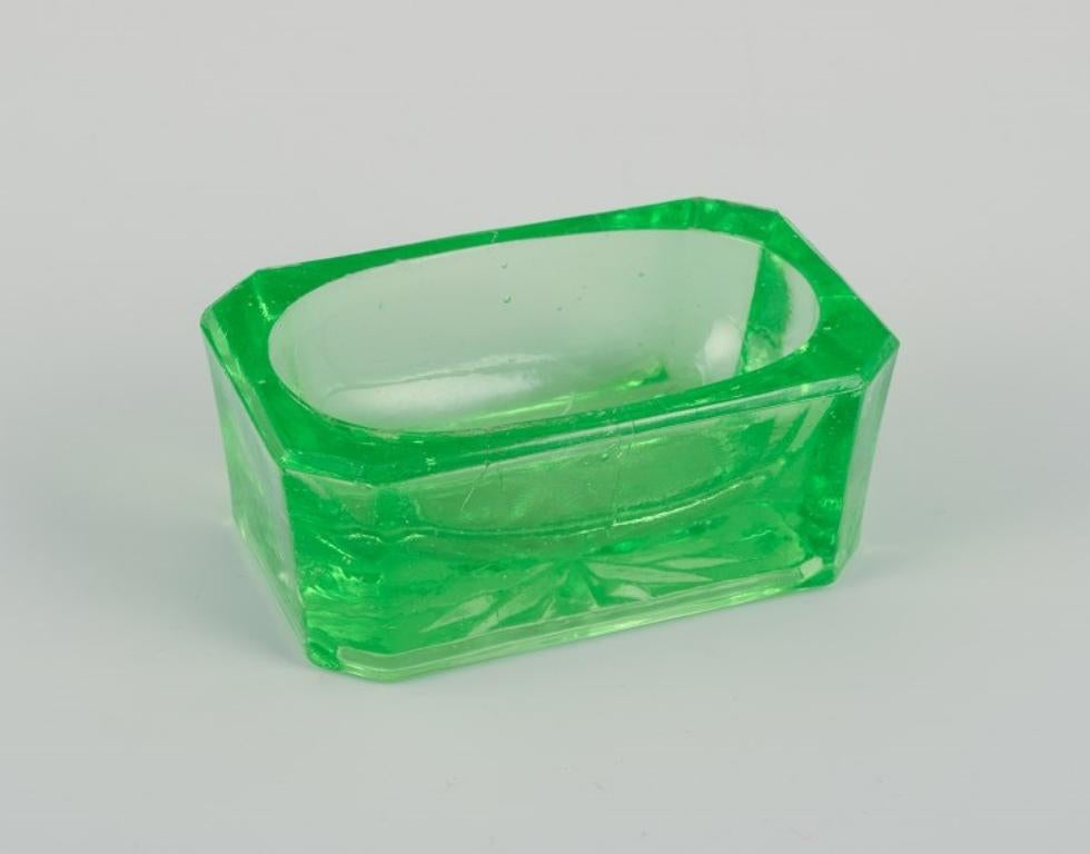 Fåglavik Glasbruk (1874-1980), Sweden.
Five salt cellars in colored glass. Handmade green and yellow glass.
Private Swedish collection.
Mid-20th century.
In excellent condition.
Largest (green): Width 7.0 cm x Depth 4.5 cm x Height 2.8 cm.