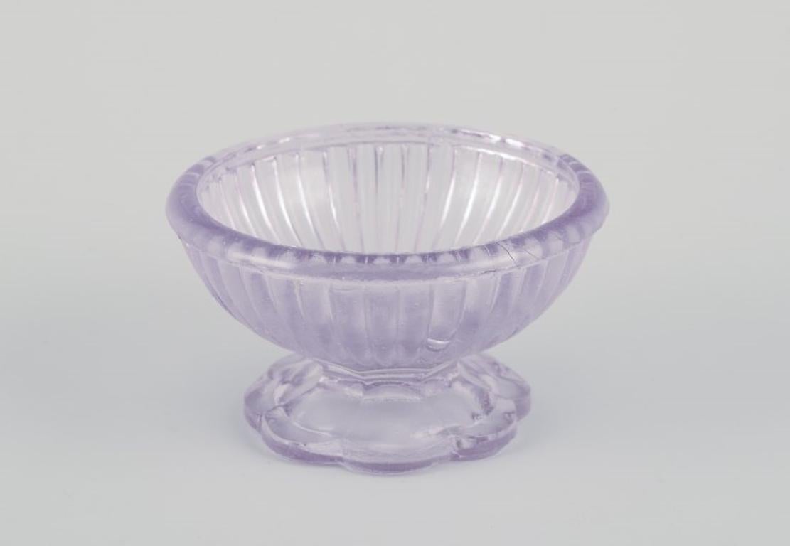 Fåglavik Glasbruk (1874-1980), Sweden.
Five salt cellars in colored glass. Handmade purple and smoke-colored glass.
Private Swedish collection.
Mid-20th century.
In excellent condition.
Largest (light purple): Diameter 7.2 cm x Height 4.0 cm.