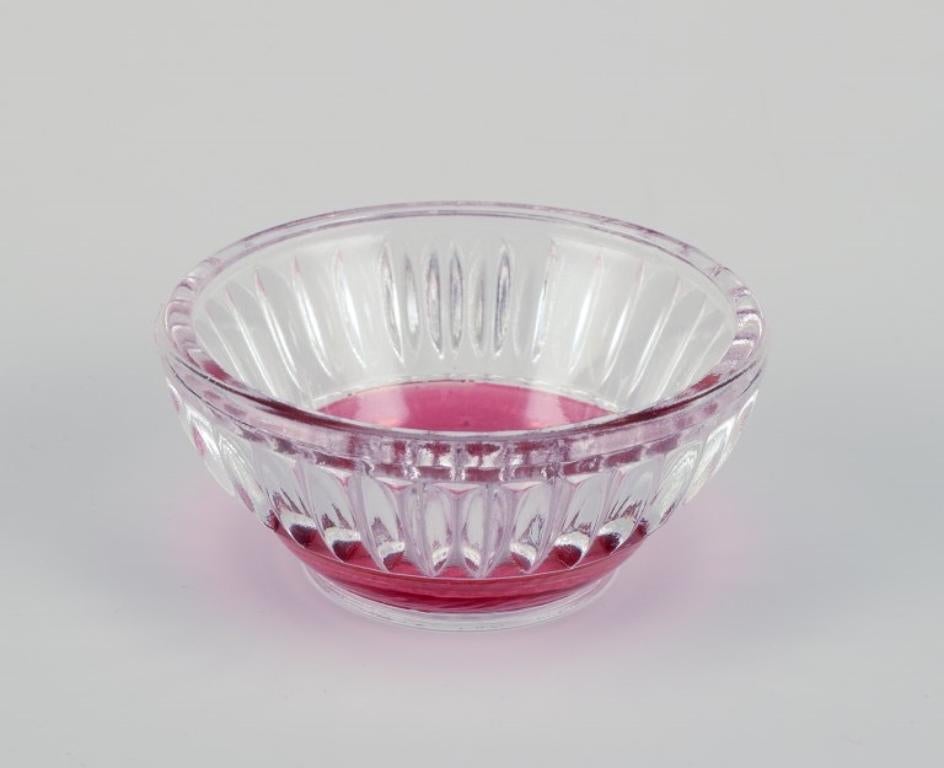 Fåglavik Glasbruk (1874-1980), Sweden.
Six salt cellars in colored glass. Handmade pink/orange glass.
Private Swedish collection.
Mid-20th century.
In excellent condition.
Largest: Diameter 6.5 cm x Height 3.0 cm.
