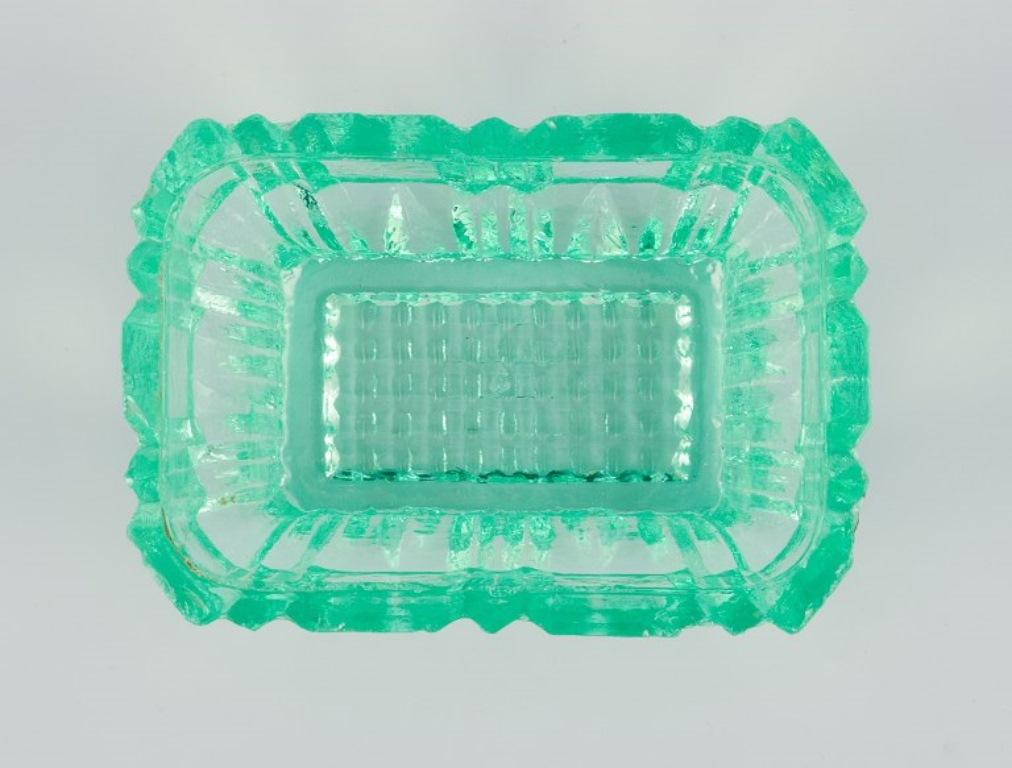 20th Century Fåglavik Glasbruk, Sweden. Three salt cellars in green glass. Mid-20th C. For Sale