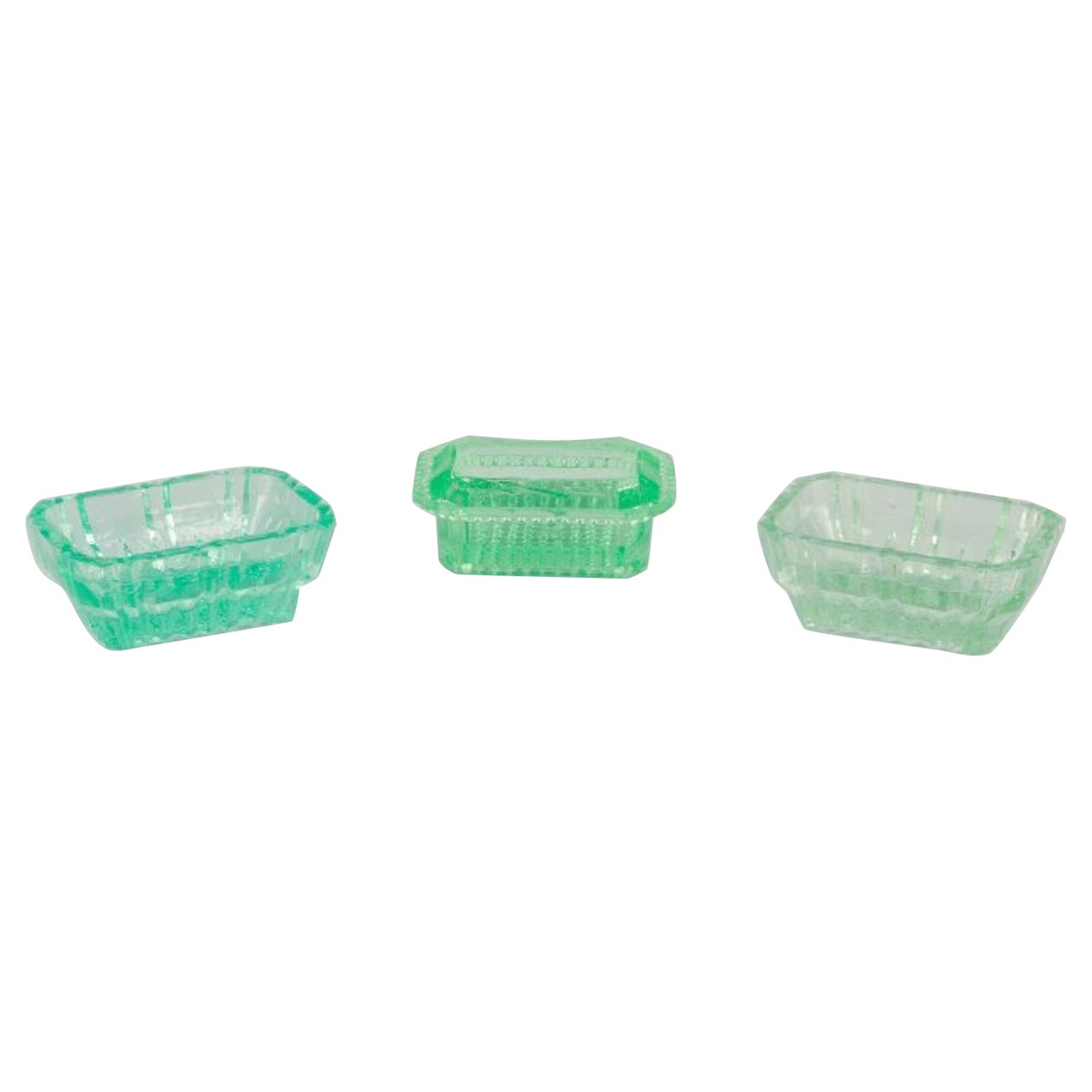 Fåglavik Glasbruk, Sweden. Three salt cellars in green glass. Mid-20th C.