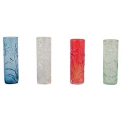 Fåglavik, Sweden. Set of four art glass vases with flower motifs.