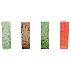 Fåglavik, Sweden. Set of four art glass vases with flower motifs.