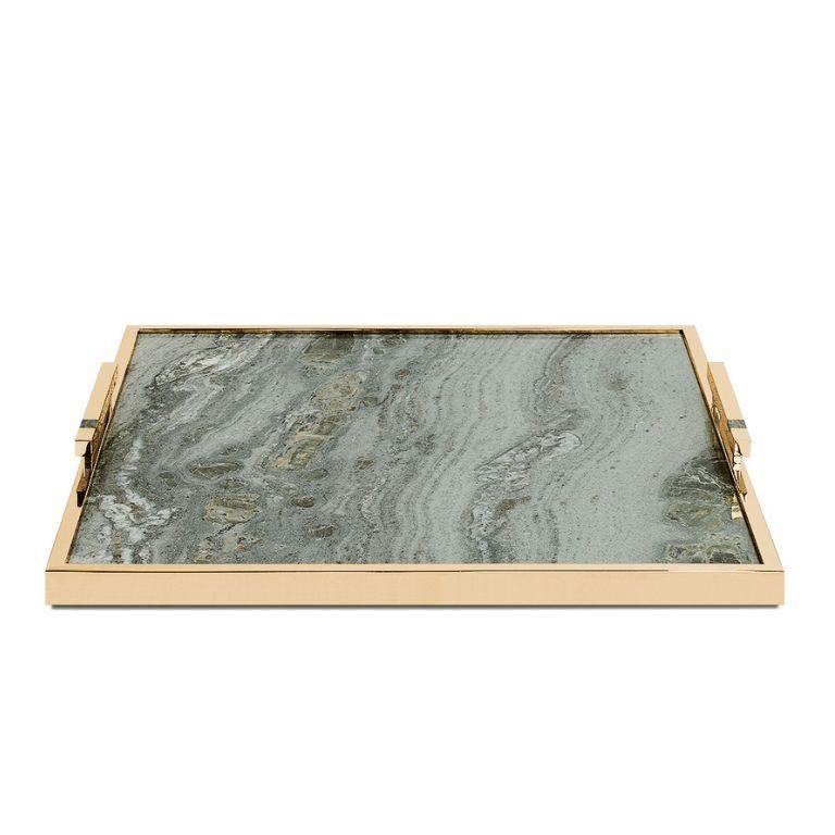 The Fahari Large Tray is a true statement piece, designed to elevate any ambiance with its luxurious combination of materials and refined craftsmanship. 

Featuring a stunning gold-plated finish, this tray is anchored by a unique marble base,