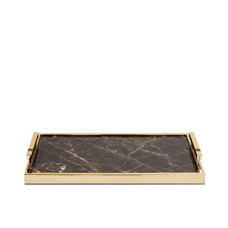 This tray is a statement piece for any ambiance - a stunning gold plated finish, a base in a unique marble, and a few small marble stones that fit into the handles to match the tray. The center base of the marble tray features a natural veining, the