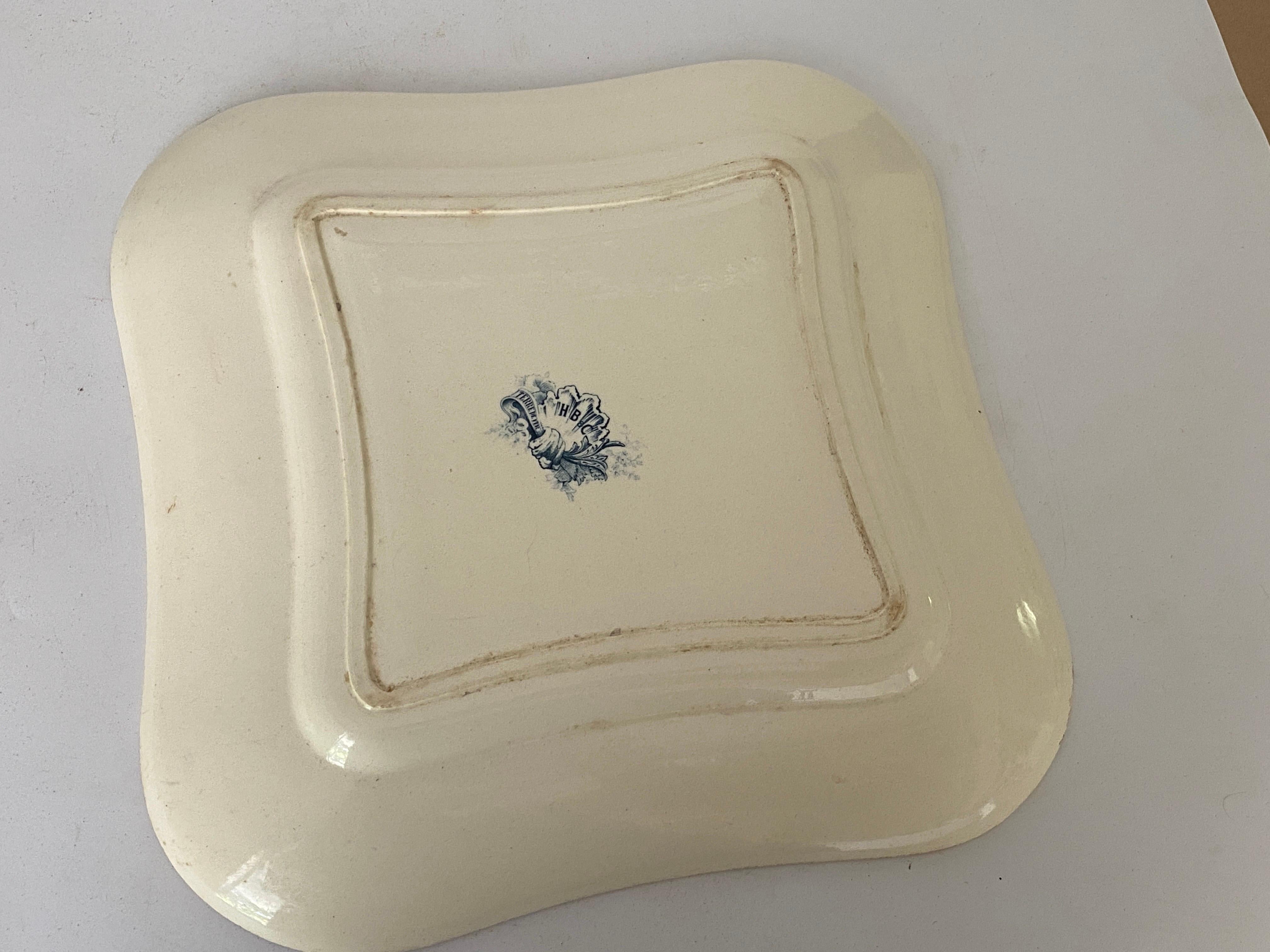 Old dish by Terre de Fer. This dish is in Faience, and has been made in France, during the 19th century.
The colors are blue. It is signed.