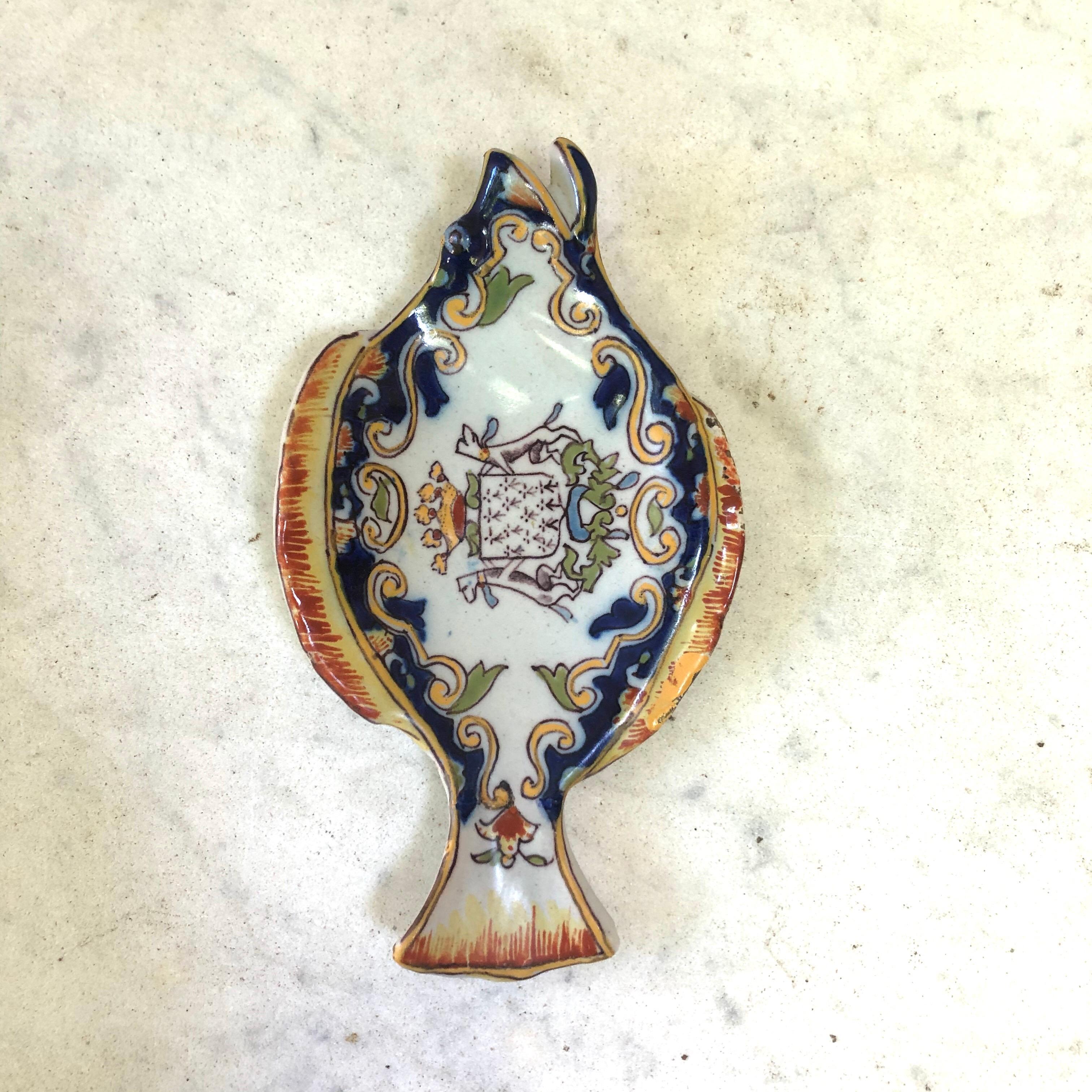 Small faience fish shape dish or platter Desvres circa 1910.
Decorated with a coat of arms.