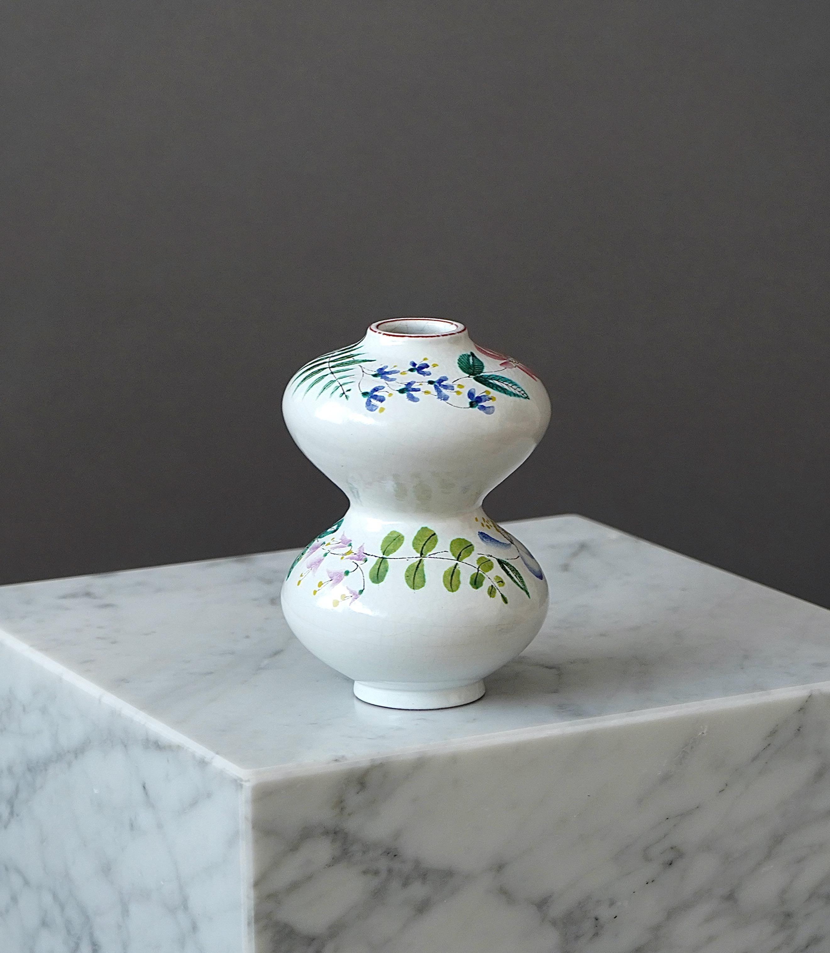 A beautiful faience vase with amazing floral decor.
Designed by Stig Lindberg in Gustavsberg Studio, Sweden, 1950s.

Excellent condition.
Signed with the Gustavsberg studio hand.

Stig Lindberg and Gustavsberg’s artistic leader Wilhelm Kåge designed